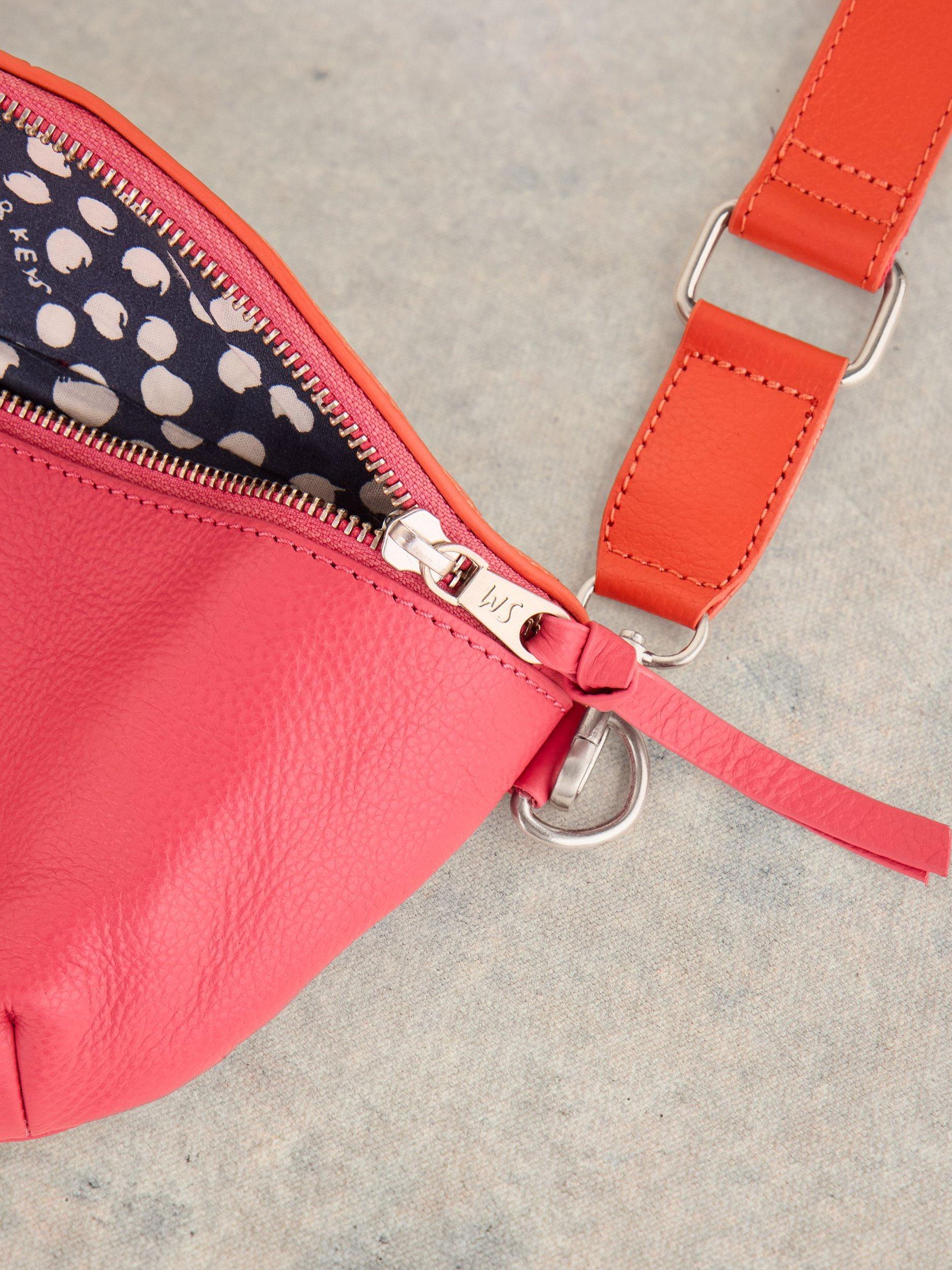 Product image 3 of 4, which shows White Stuff Mini Sebby Leather Sling Bag, Pink/Orange, One Size