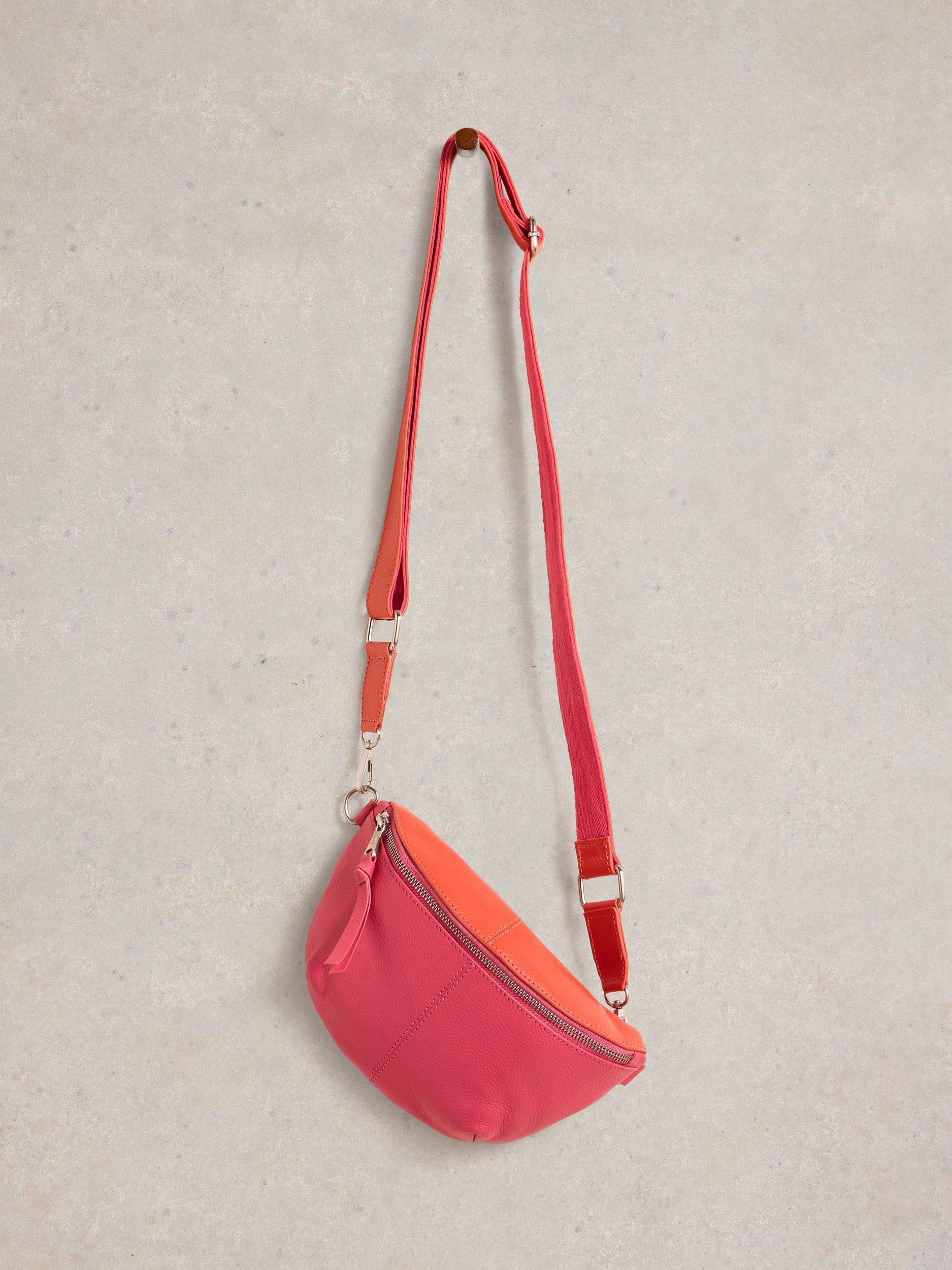Product image 4 of 4, which shows White Stuff Mini Sebby Leather Sling Bag, Pink/Orange, One Size