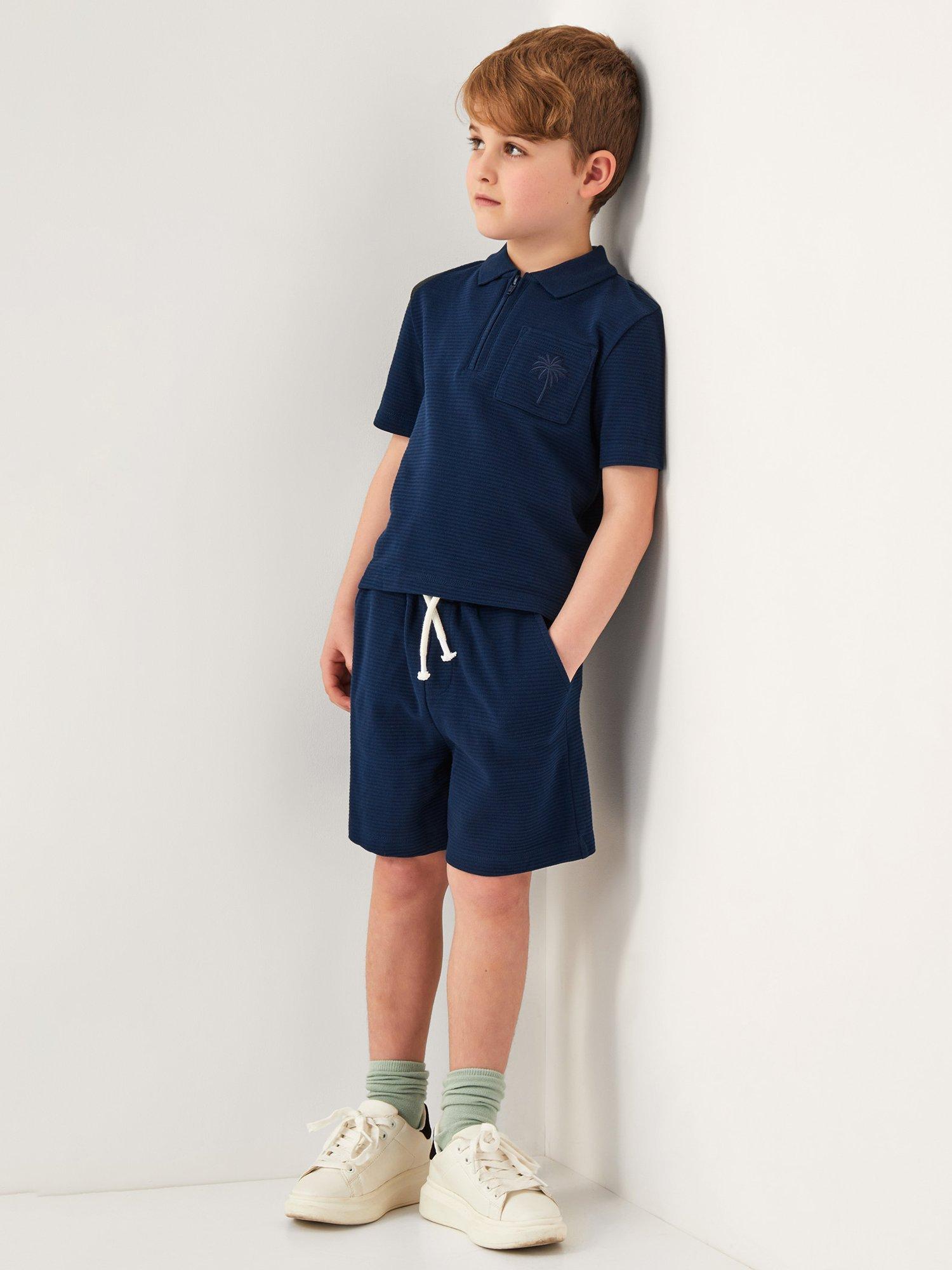Product image 1 of 4, which shows Monsoon Kids' Cotton Polo Shirt & Shorts Set, Blue, 12-13 years