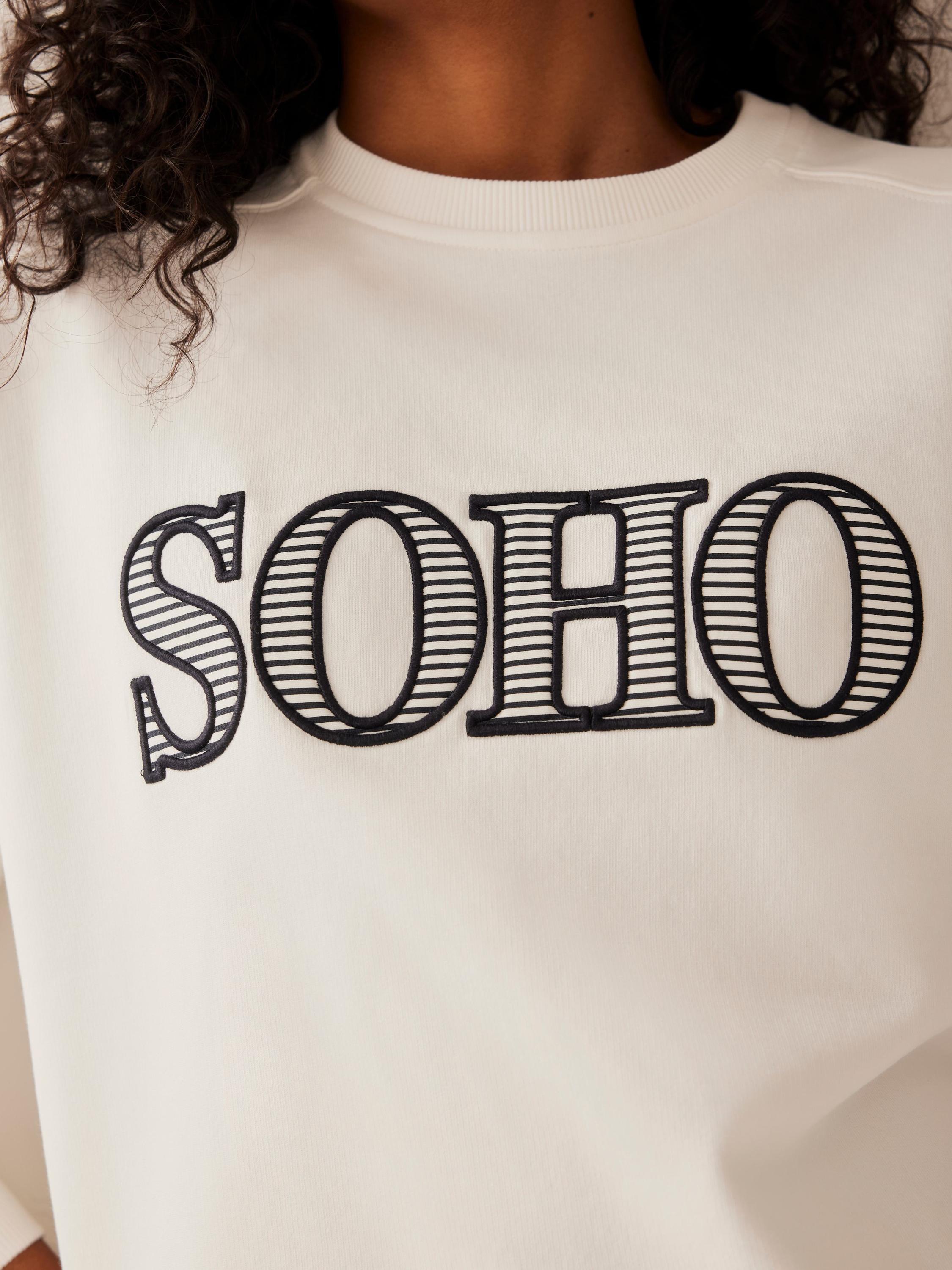 Product image 3 of 8, which shows Mint Velvet Cotton Blend Graphic Sweatshirt, White Ivory, M