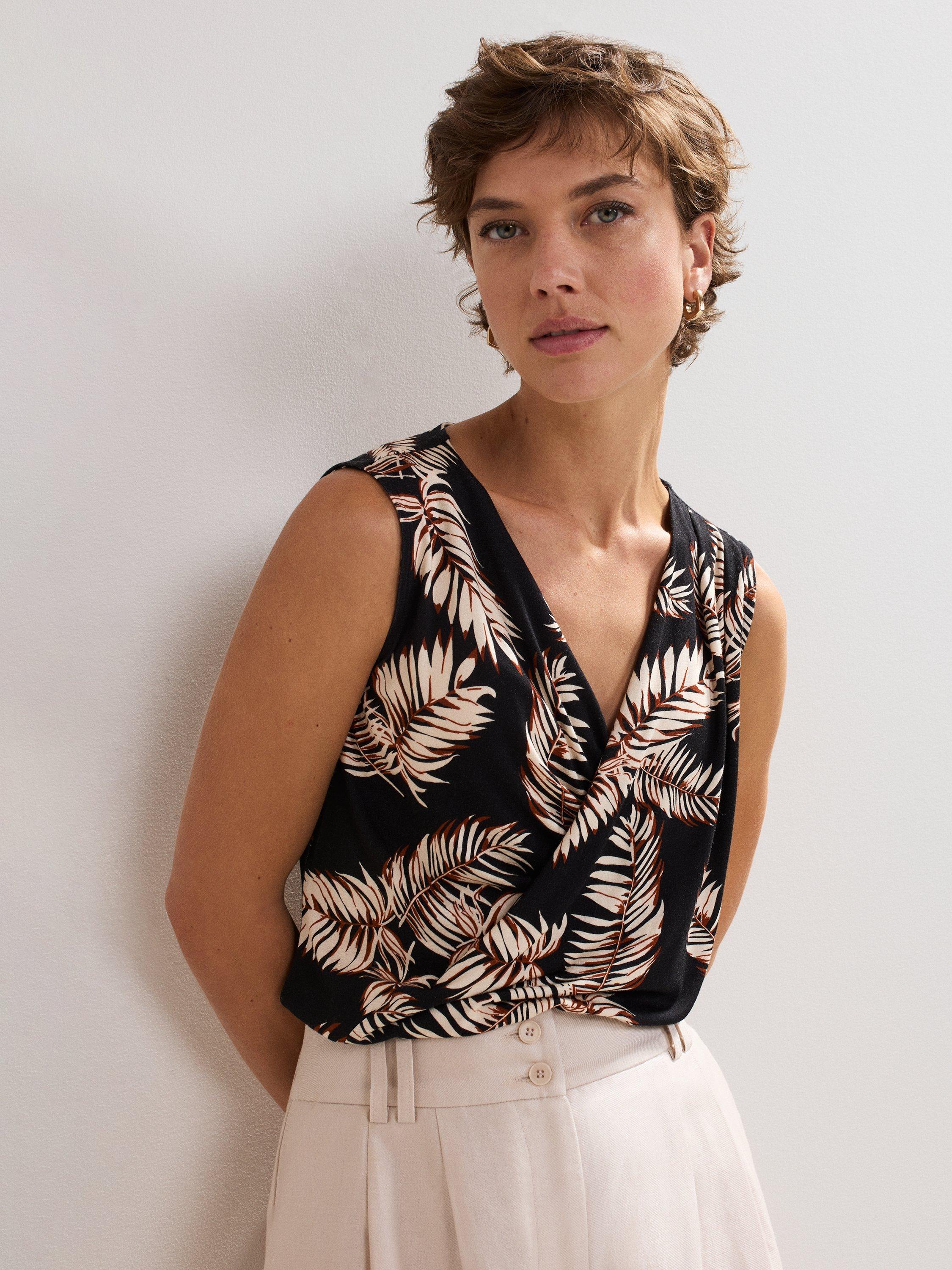 Product image 1 of 8, which shows Phase Eight Sutton Wrap Front Leaf Print Top, Black, 8
