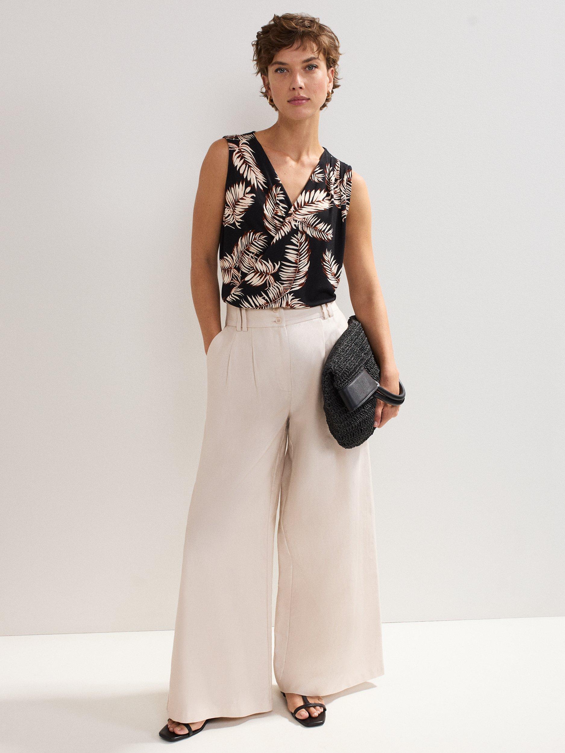 Product image 3 of 8, which shows Phase Eight Sutton Wrap Front Leaf Print Top, Black, 8