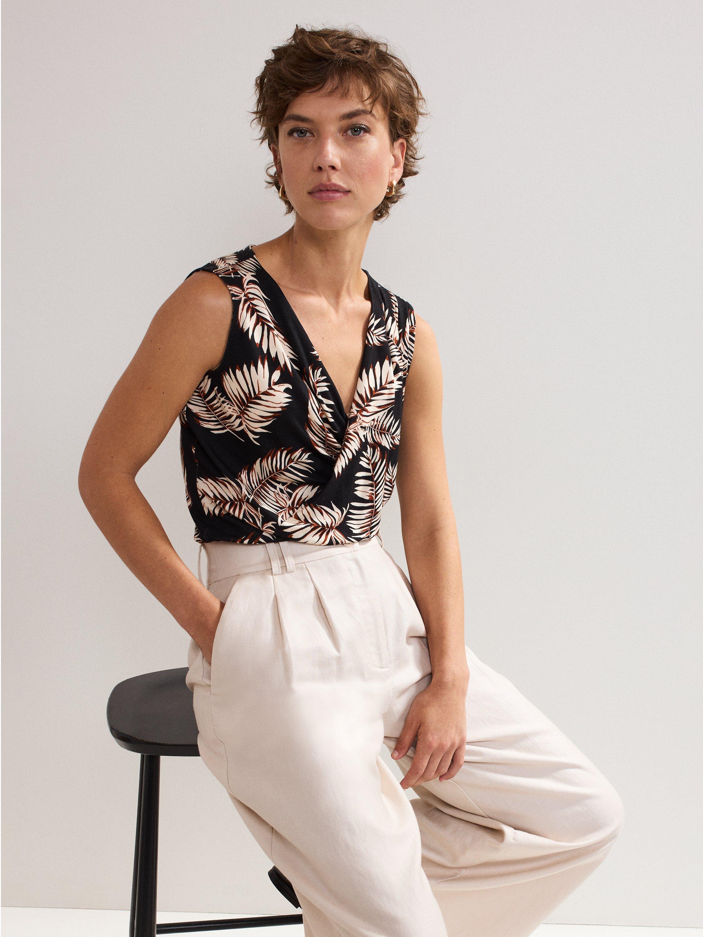 Product image 4 of 8, which shows Phase Eight Sutton Wrap Front Leaf Print Top, Black, 8