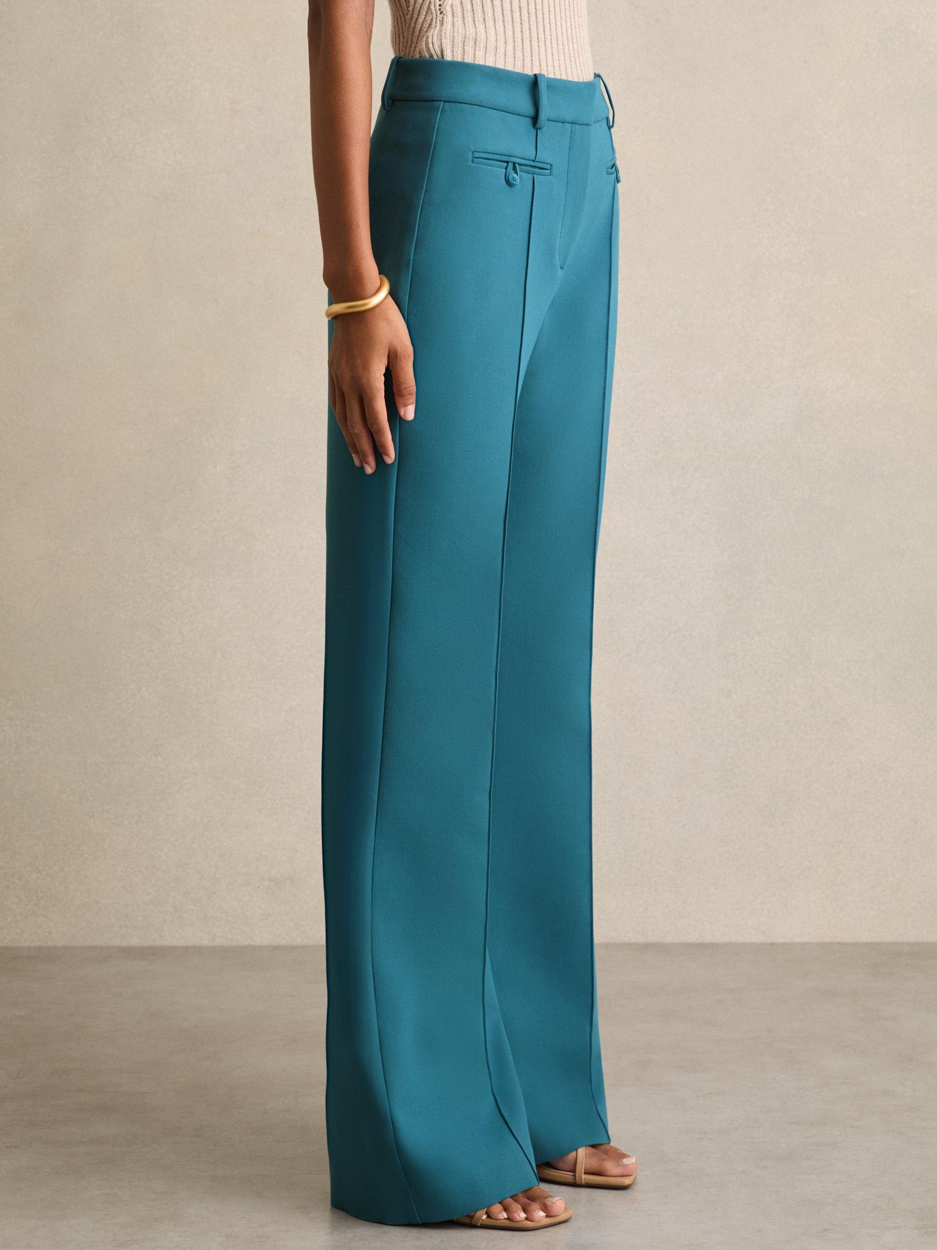 Product image 1 of 5, which shows Reiss Petite Abbey Mid Rise Flared Trousers, Teal, 8Pt