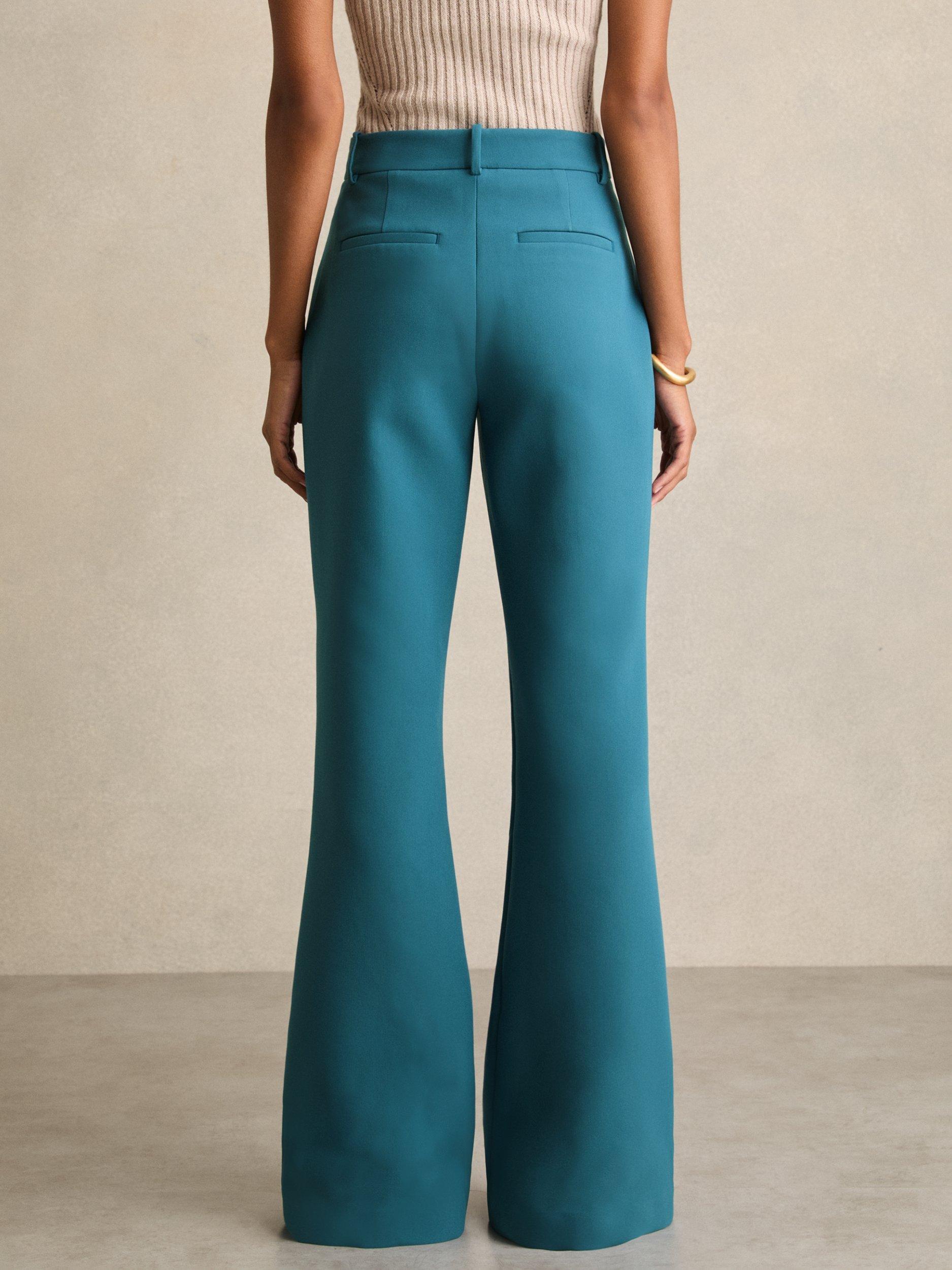 Product image 3 of 5, which shows Reiss Petite Abbey Mid Rise Flared Trousers, Teal, 8Pt