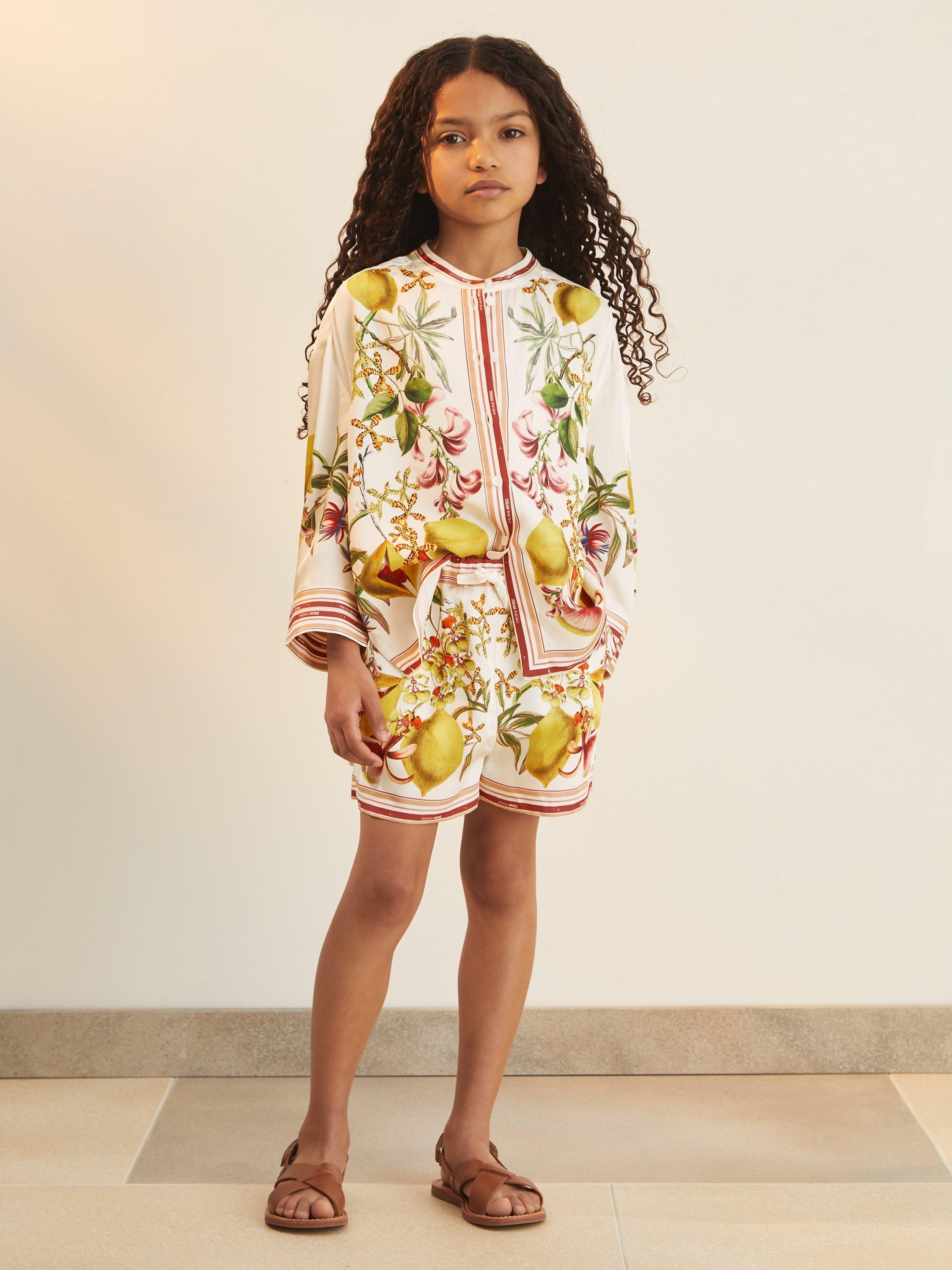 Product image 1 of 5, which shows Reiss New York Botanical Gardens Kids' Sammie Lemon Print Shorts, Ivory, 8-9 years