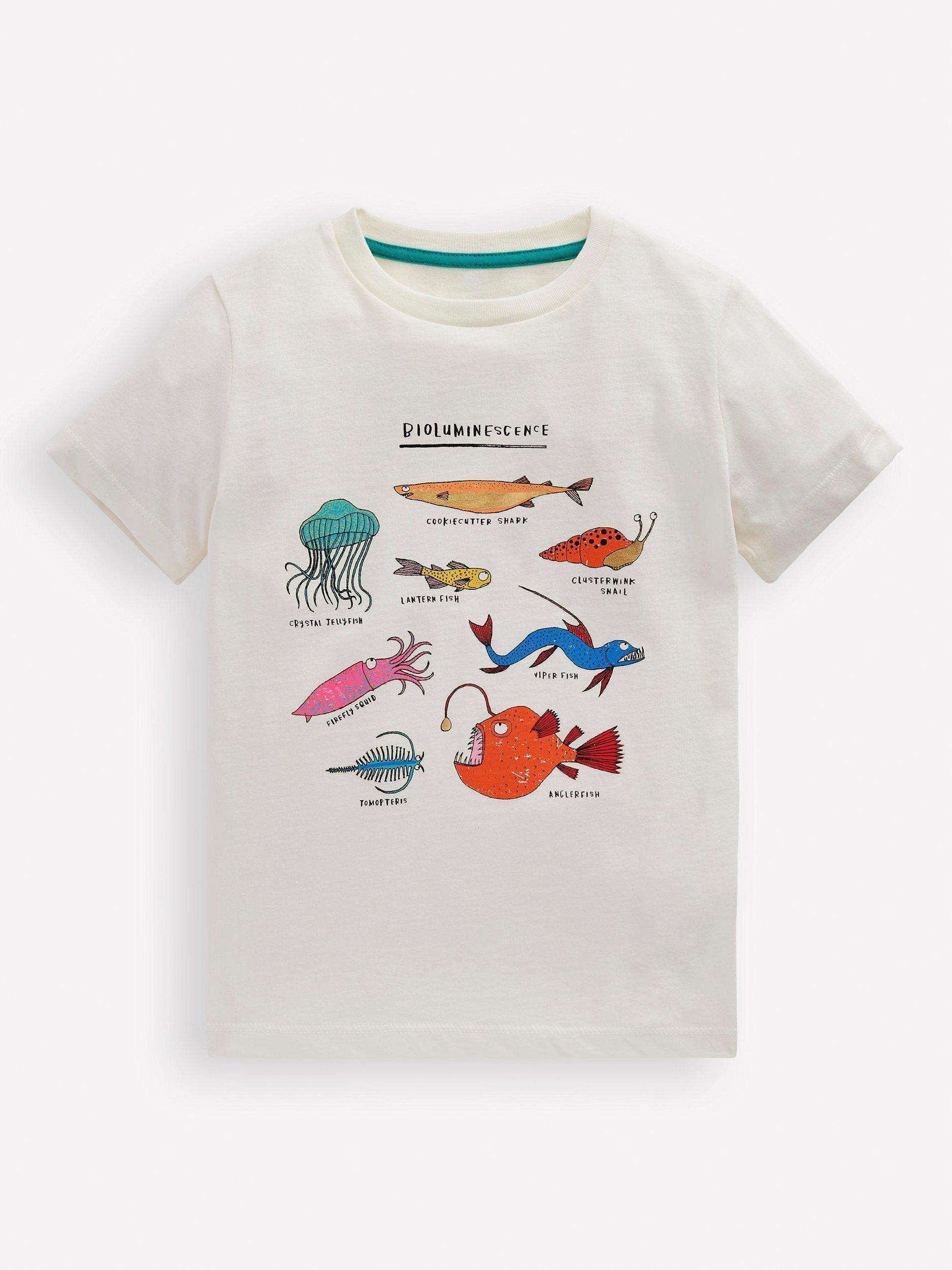 Product image 1 of 3, which shows Mini Boden Kids' Cotton Glow-In-The-Dark T-Shirt, Soft Ivory Bio, 2-3 years