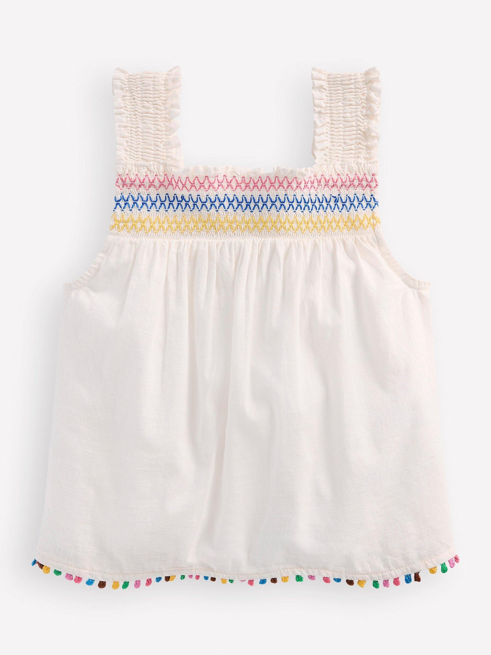 Product image 1 of 3, which shows Mini Boden Kids' Cotton Woven Smocked Top, Soft Ivory, 2-3 years