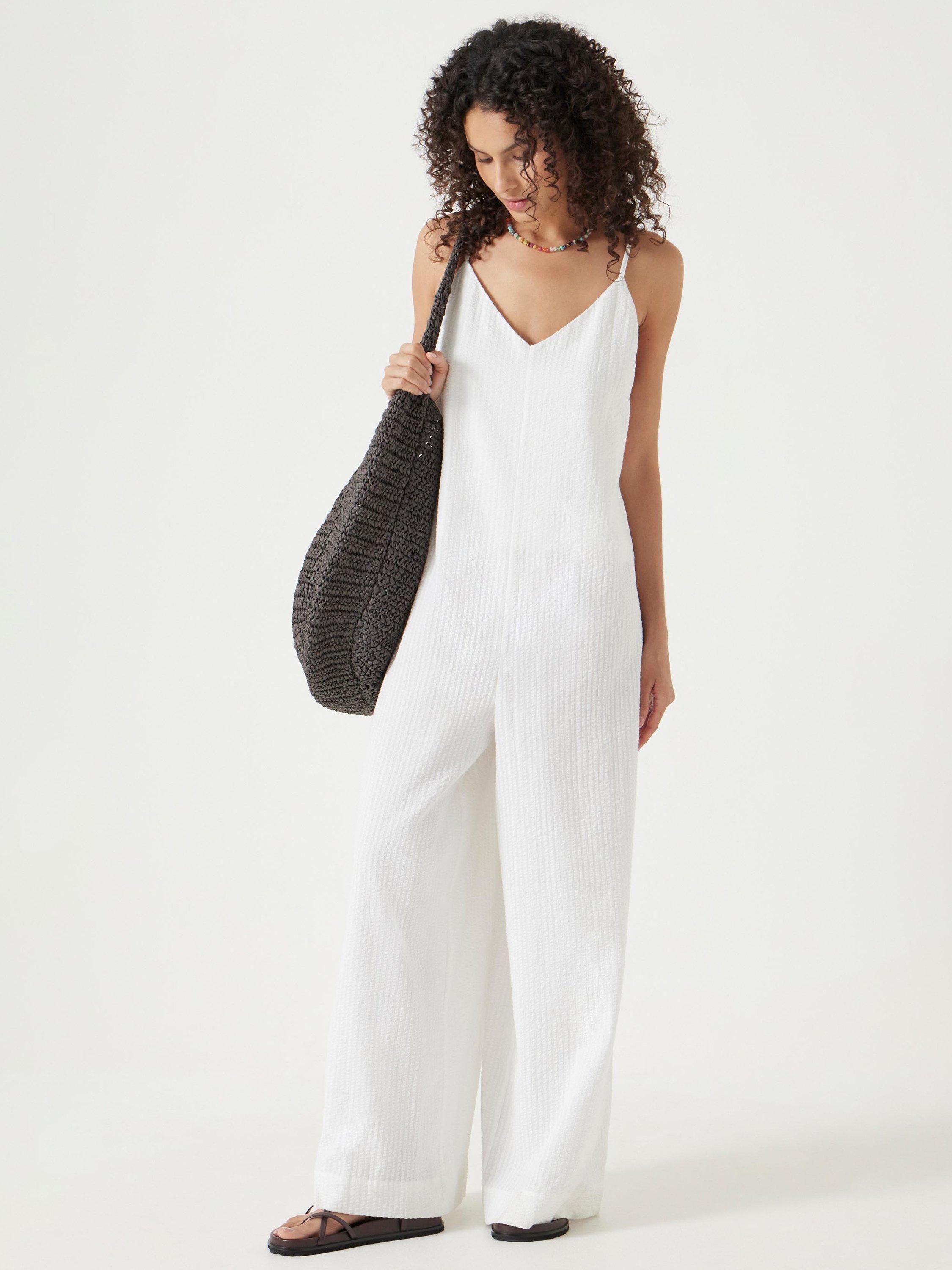 Product image 1 of 6, which shows HUSH Seersucker Cotton Flared Jumpsuit, White, L