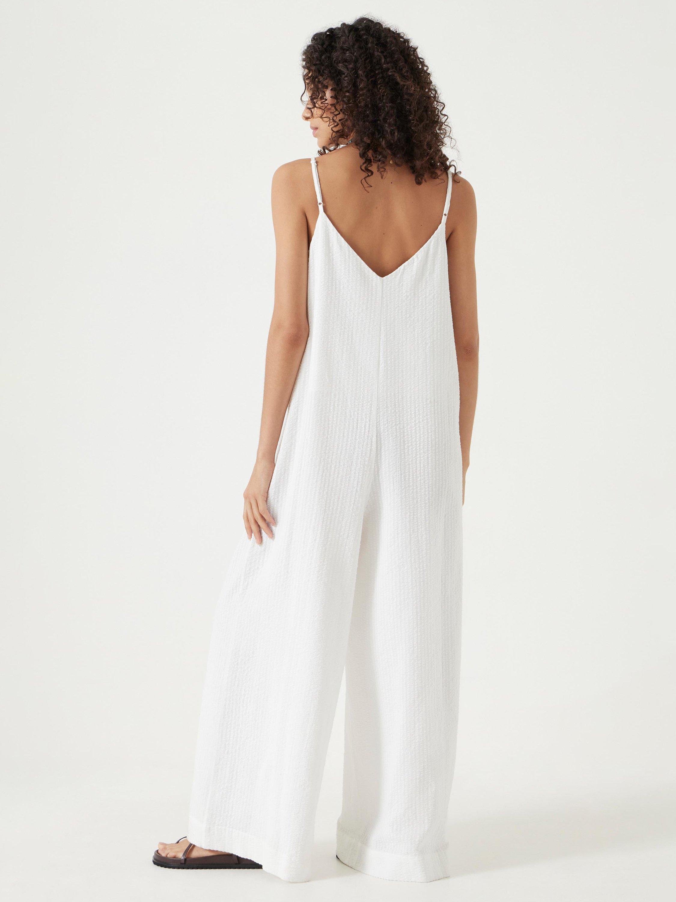 Product image 3 of 6, which shows HUSH Seersucker Cotton Flared Jumpsuit, White, L