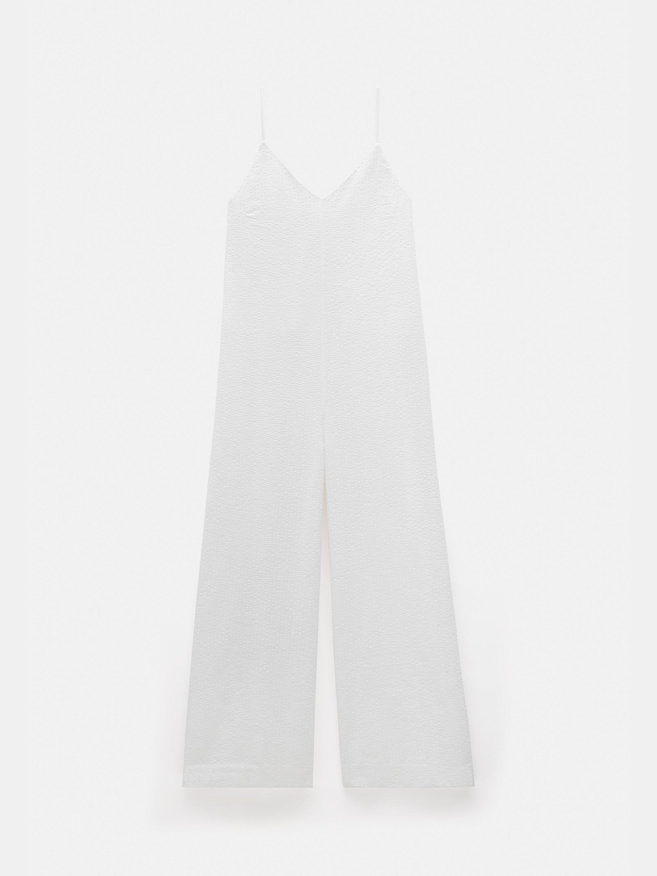 Product image 4 of 6, which shows HUSH Seersucker Cotton Flared Jumpsuit, White, L