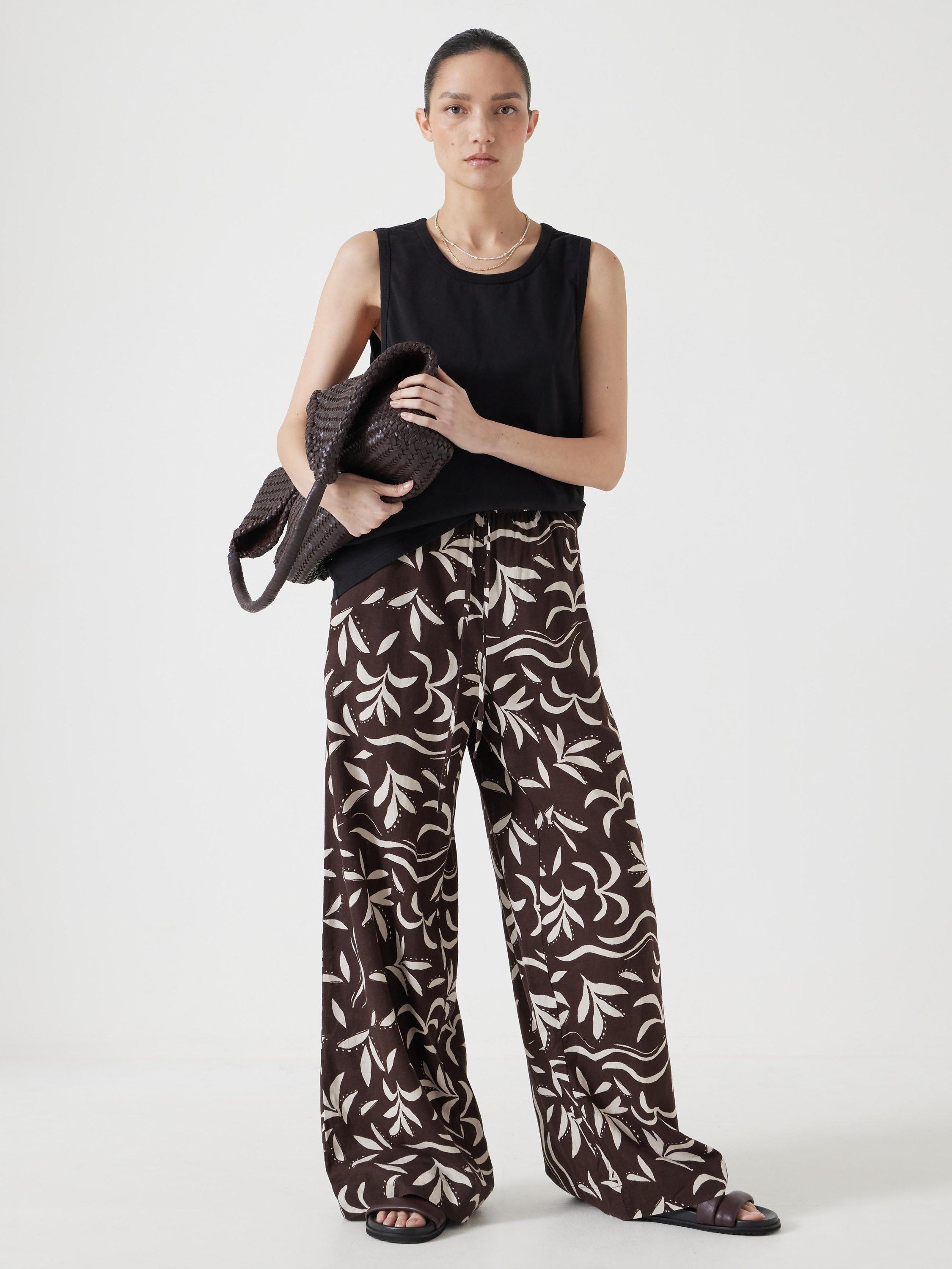 Product image 2 of 5, which shows HUSH Carla Relaxed Tank Top, Black, XXS