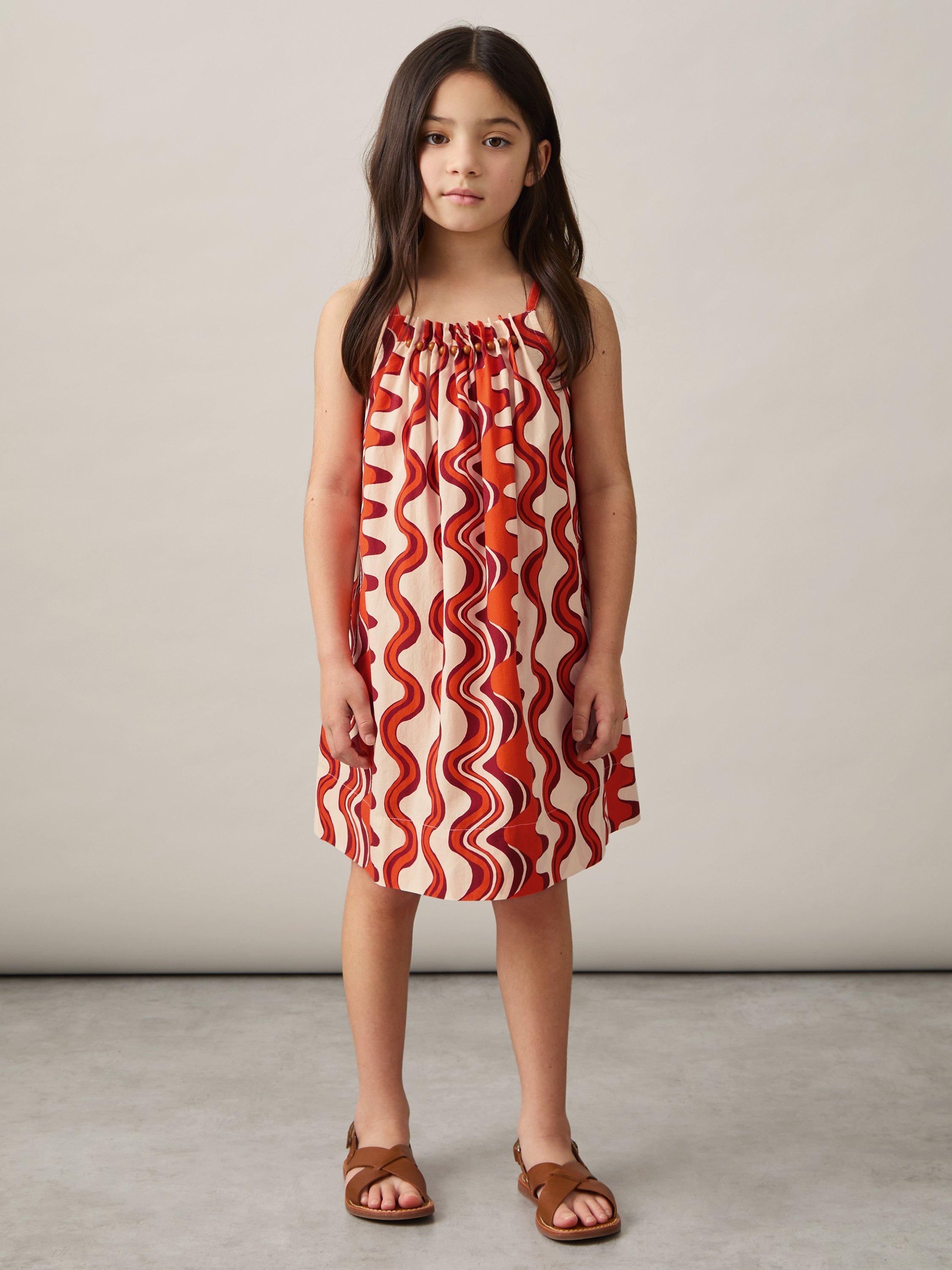 Product image 1 of 4, which shows Reiss Kids' Cotton Beaded Sleeveless Abstract Print Dress, Red, 6-7 years