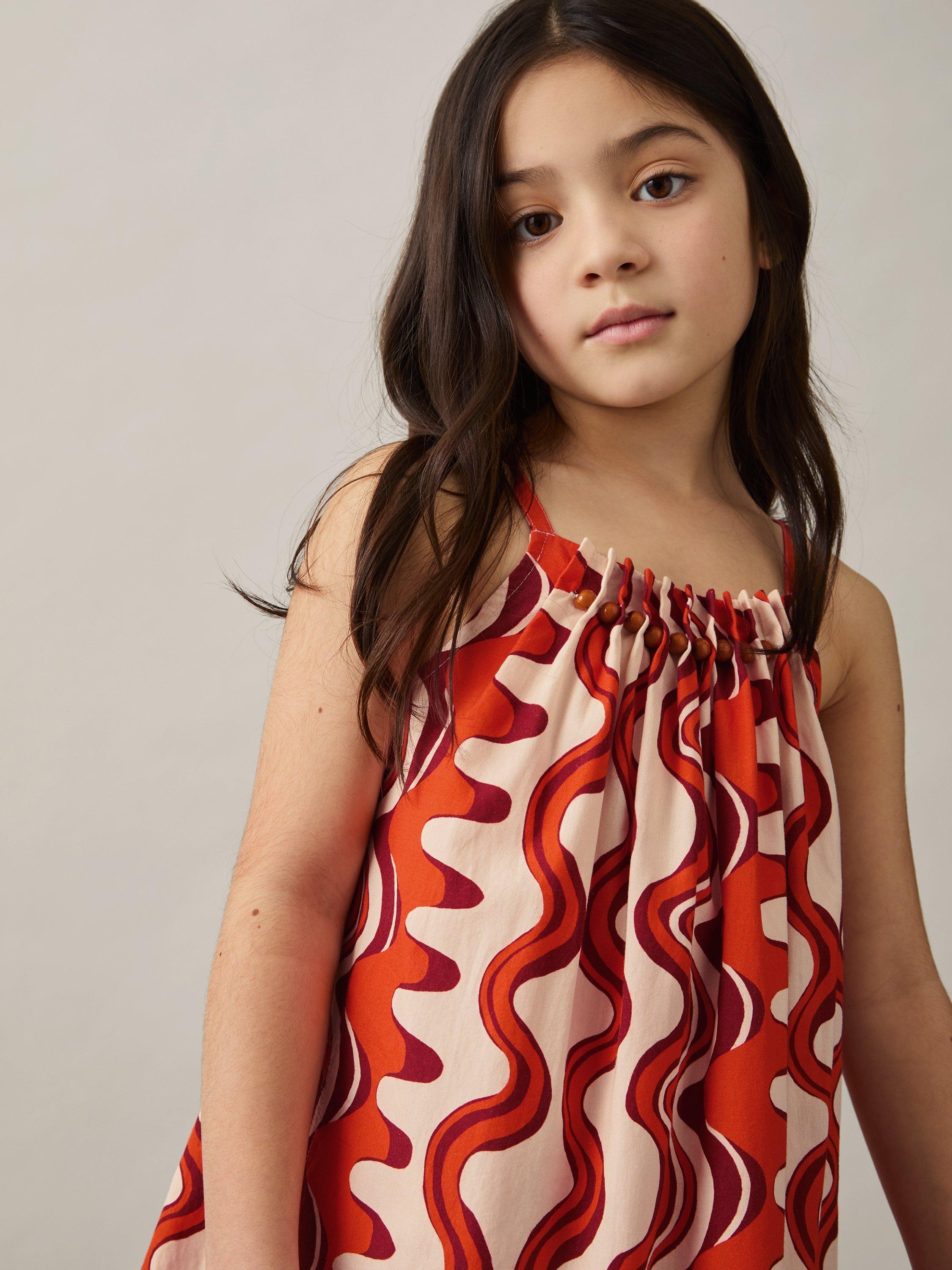 Product image 3 of 4, which shows Reiss Kids' Cotton Beaded Sleeveless Abstract Print Dress, Red, 6-7 years