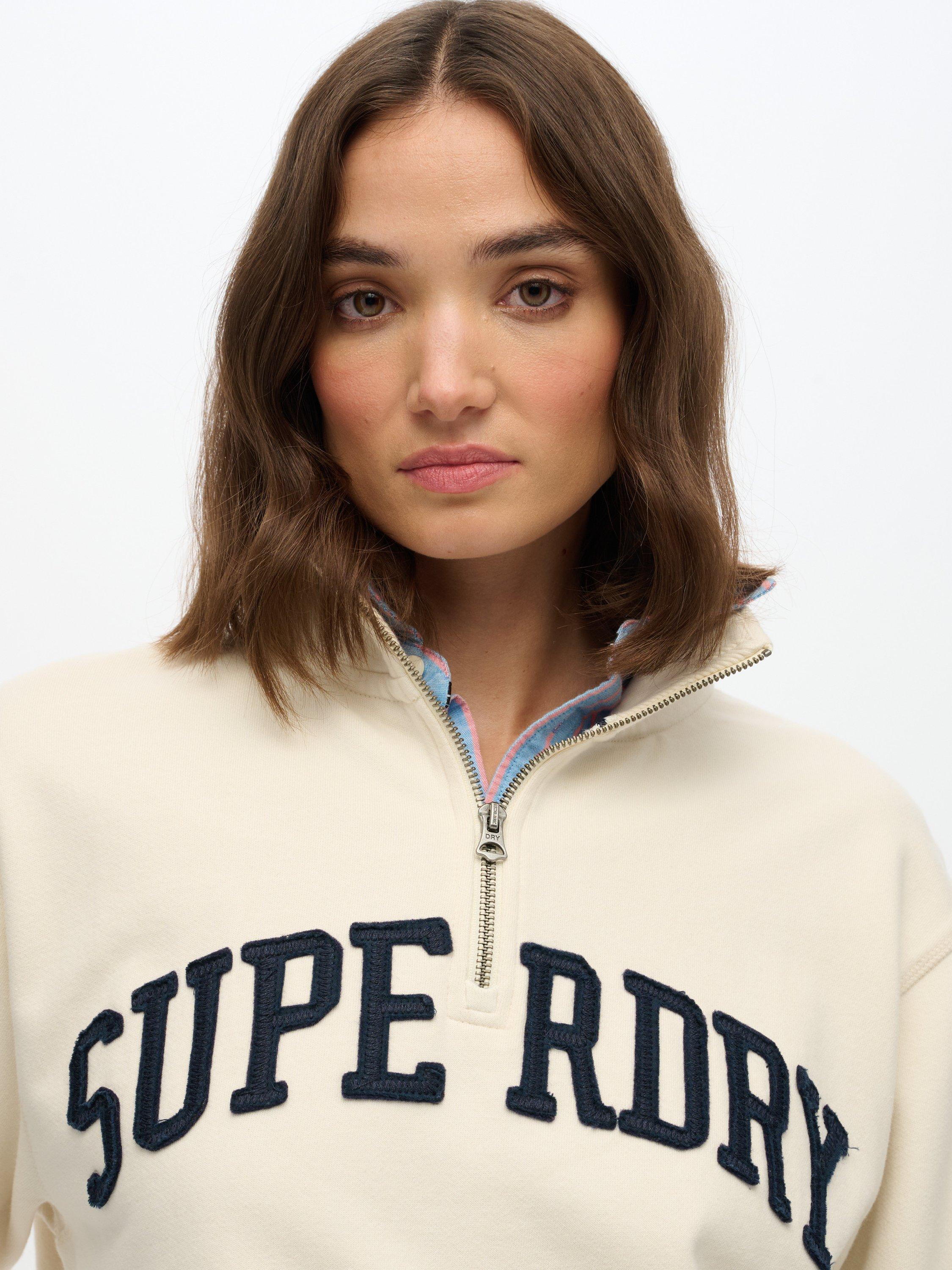 Product image 4 of 5, which shows Superdry Athletic Essentials Applique 1/2 Zip Sweatshirt, Desert Bone White, 10