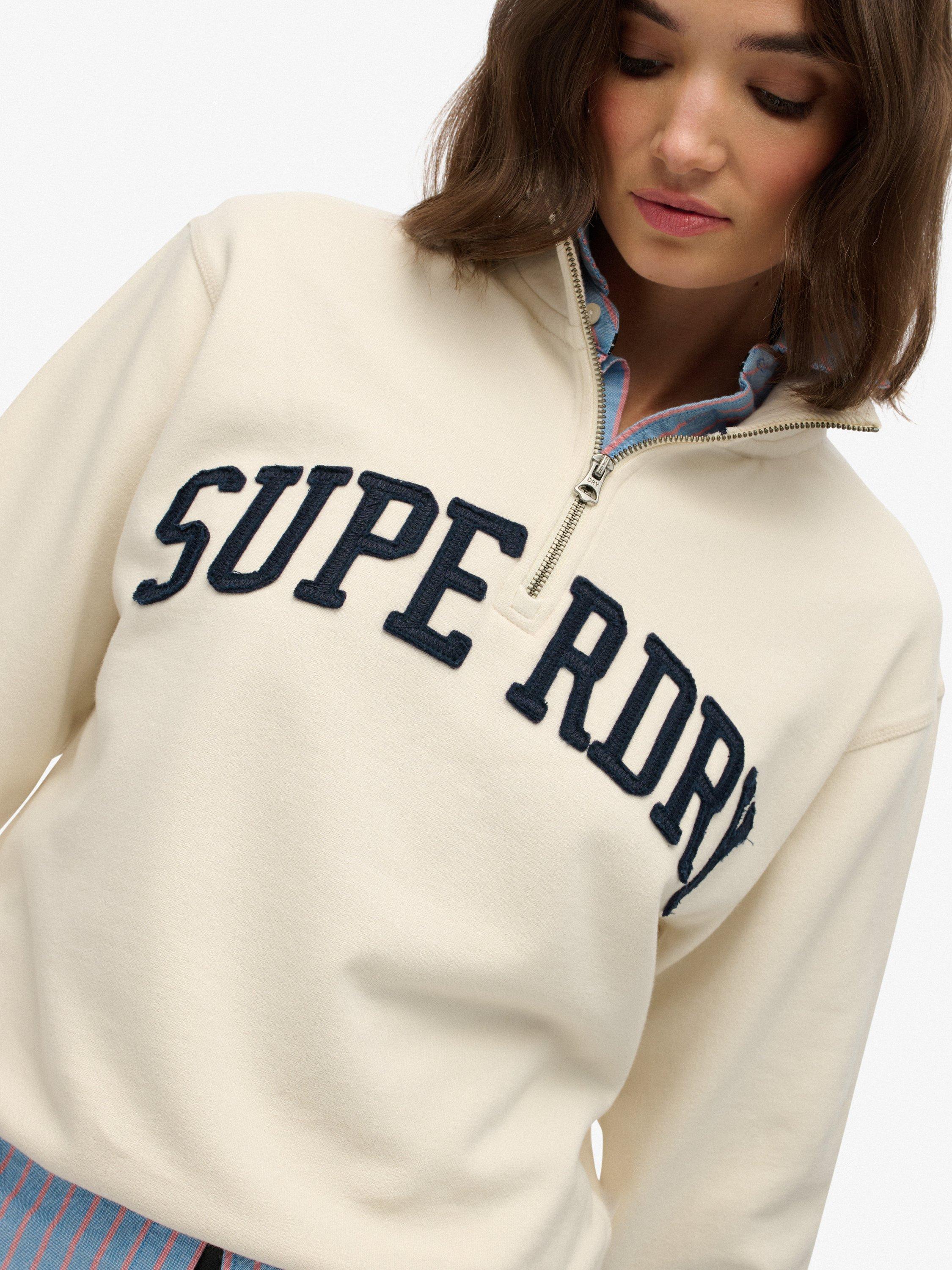 Product image 5 of 5, which shows Superdry Athletic Essentials Applique 1/2 Zip Sweatshirt, Desert Bone White, 10