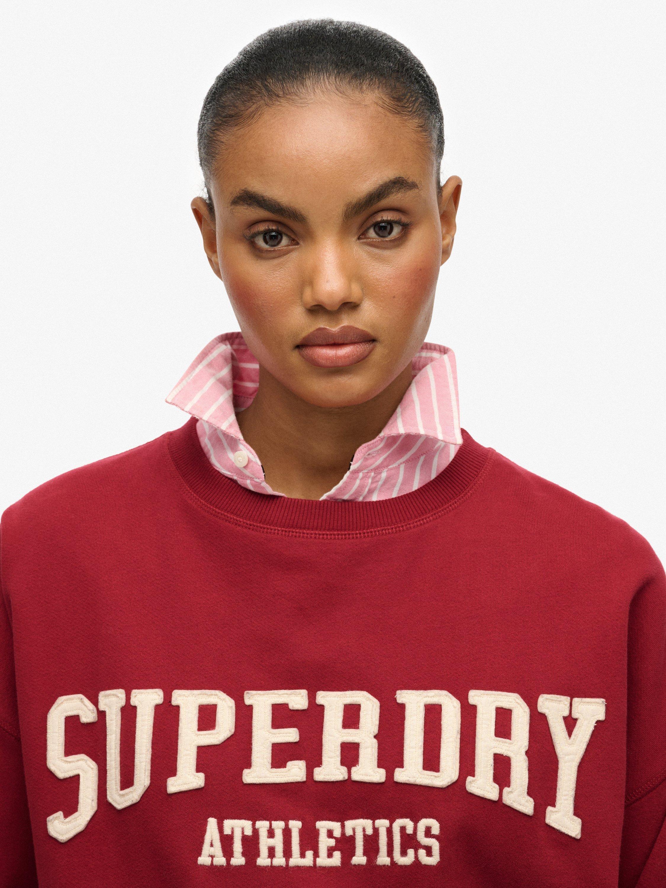 Product image 5 of 6, which shows Superdry Athletic Essentials Relaxed Applique Sweatshirt, Bordeaux Red, 10