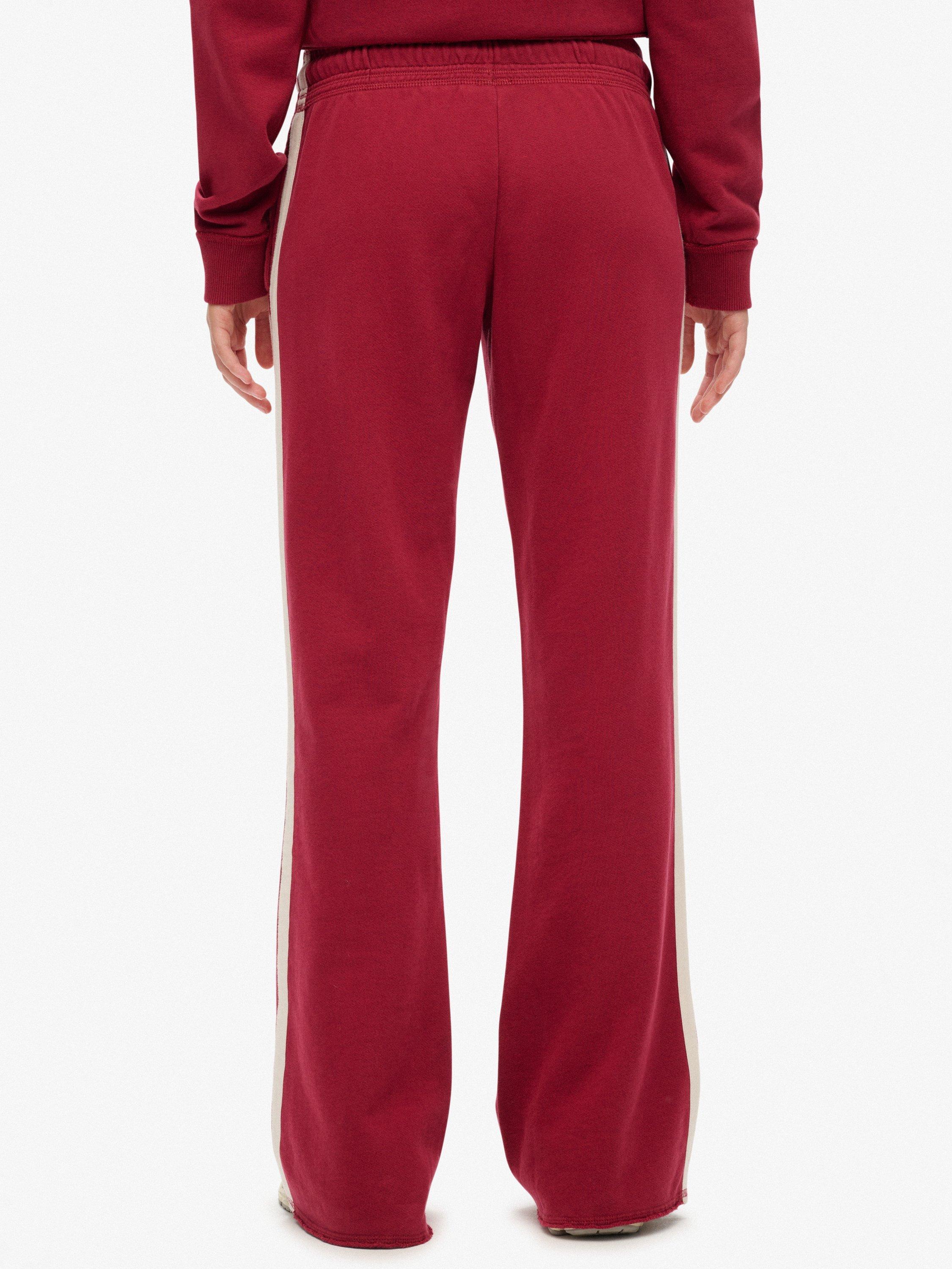 Product image 4 of 6, which shows Superdry Athletic Stripe Flare Joggers, Bordeaux Red, 10