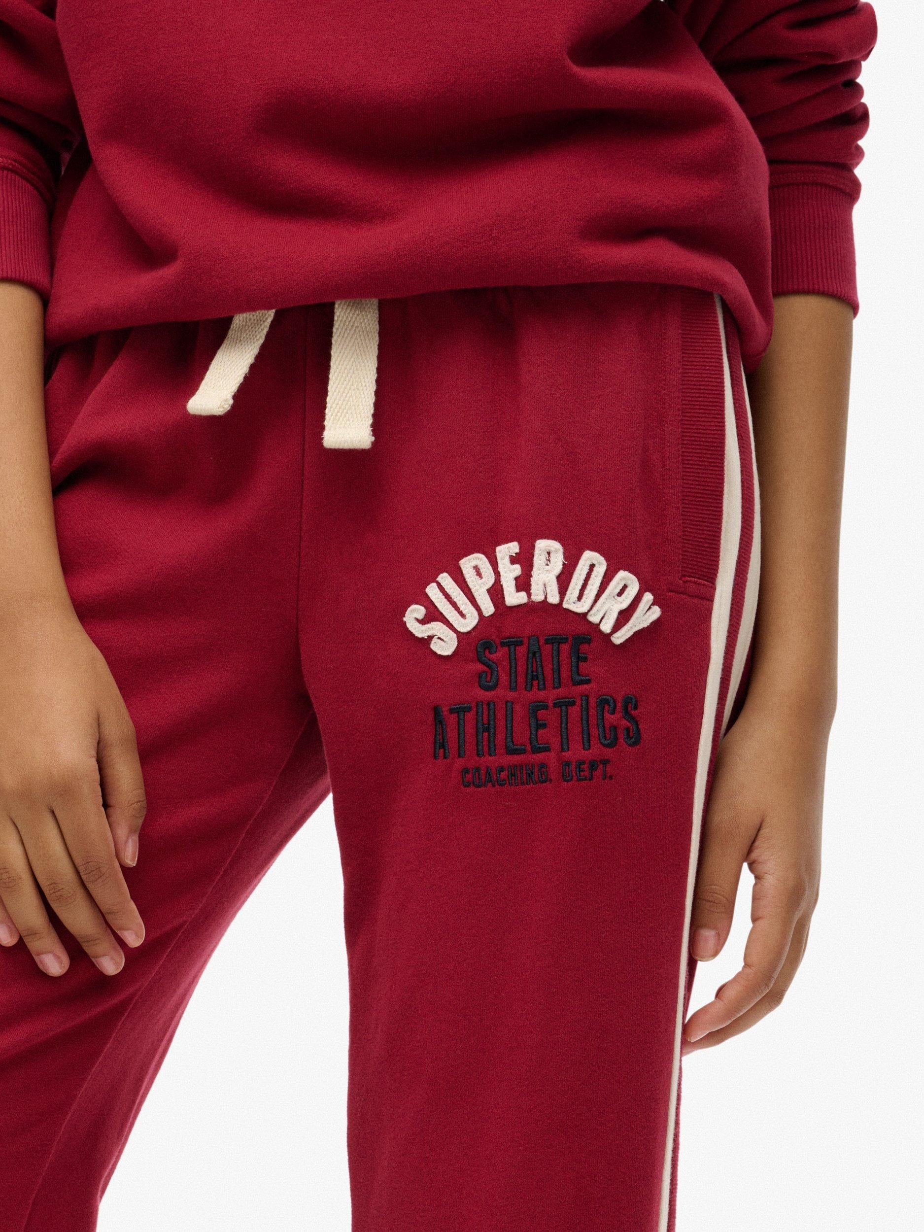 Product image 5 of 6, which shows Superdry Athletic Essentials Hockey Joggers, Bordeaux Red, 10