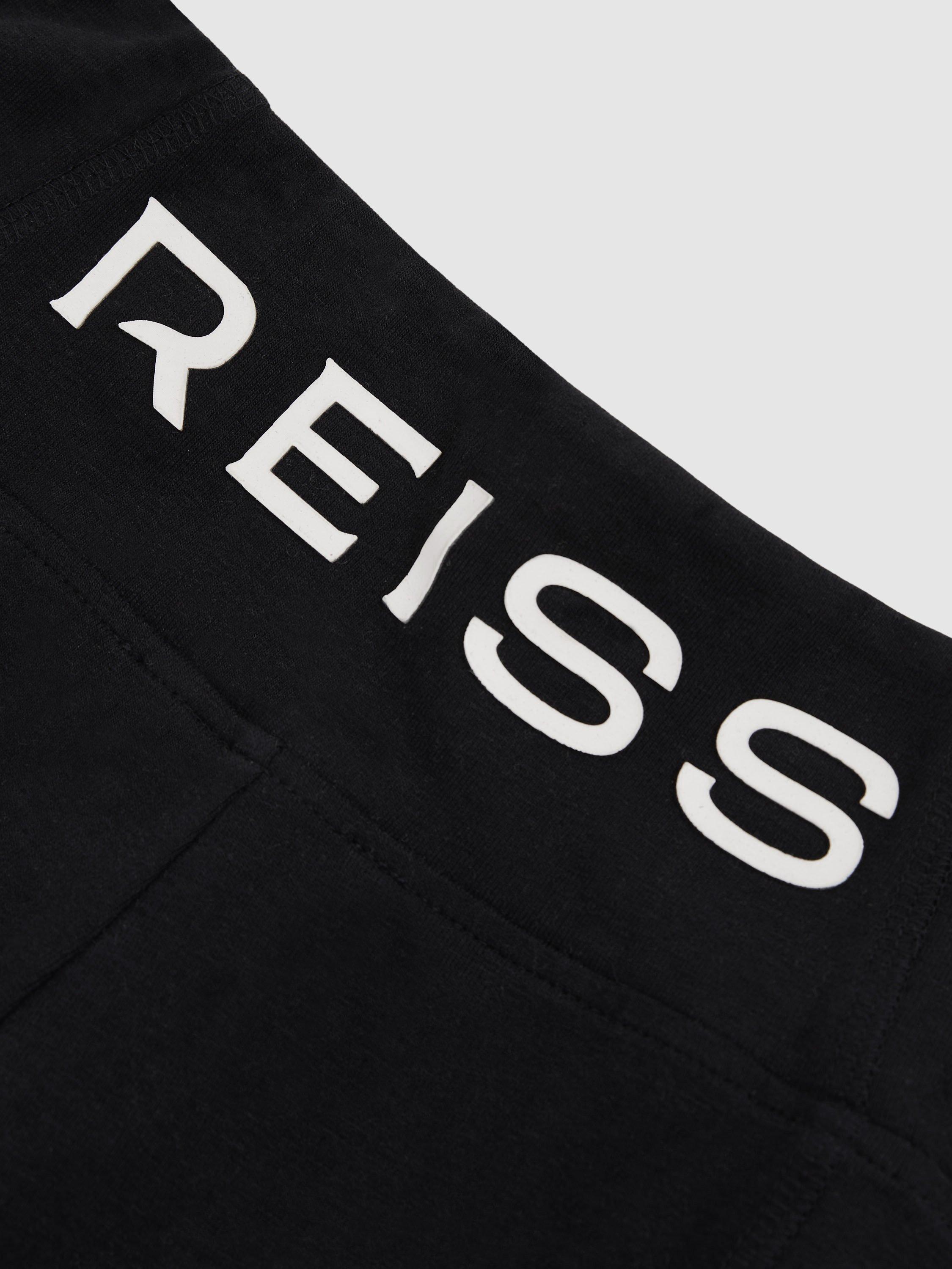 Product image 4 of 4, which shows Reiss Kids' Kristen Stretch Cotton Logo Print Leggings, Black, 4-5 years