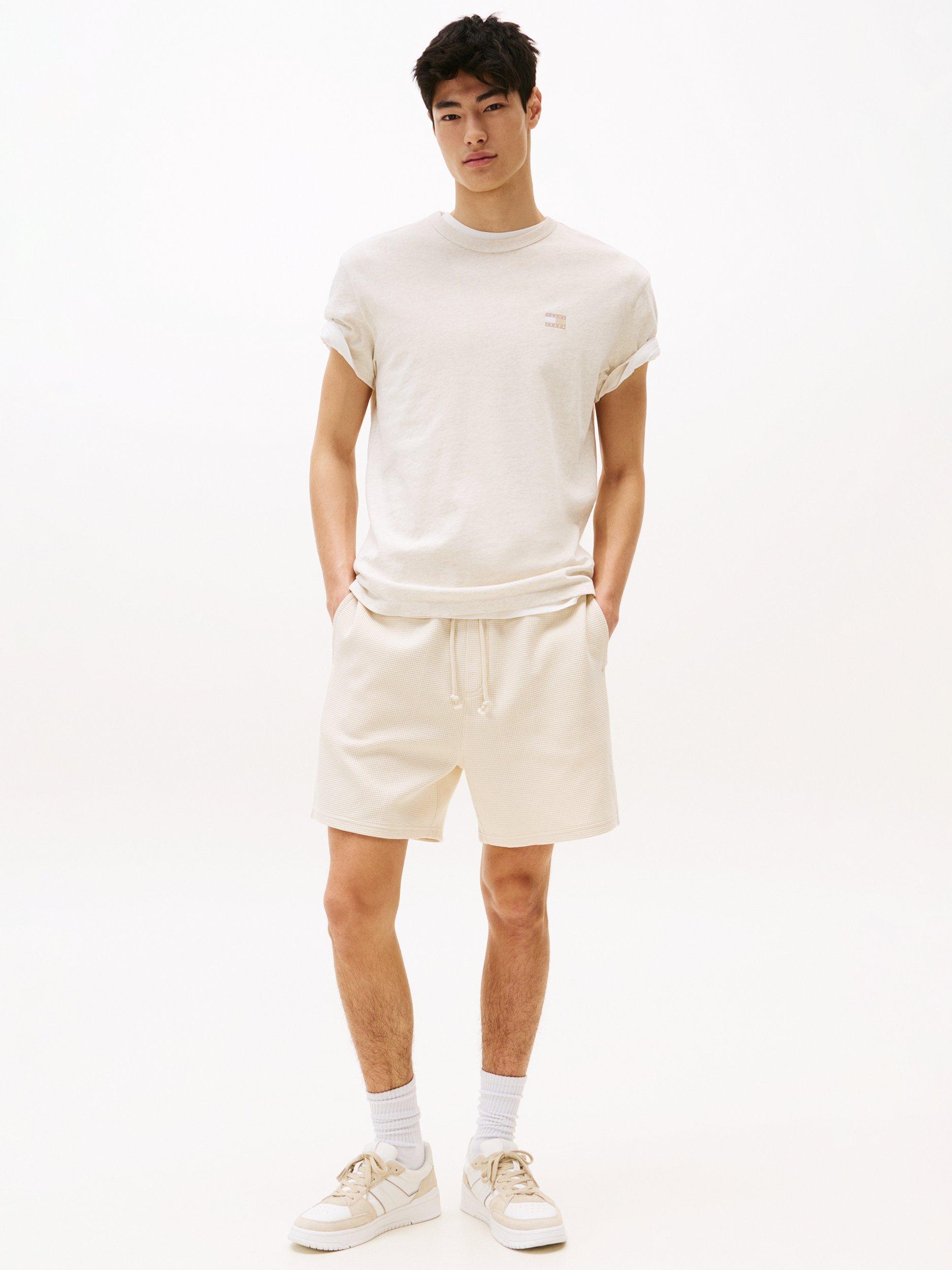 Product image 3 of 5, which shows Tommy Jeans Cotton Regular Fit Short Sleeve Tonal Logo T-Shirt, Natural, XS
