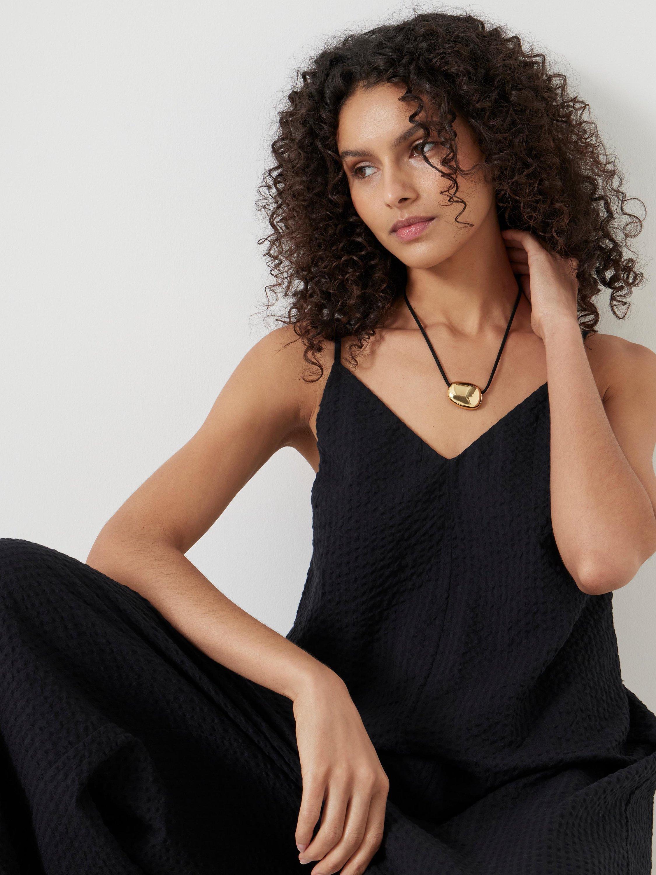 Product image 2 of 6, which shows HUSH Seersucker Cotton Flared Jumpsuit, Black, M