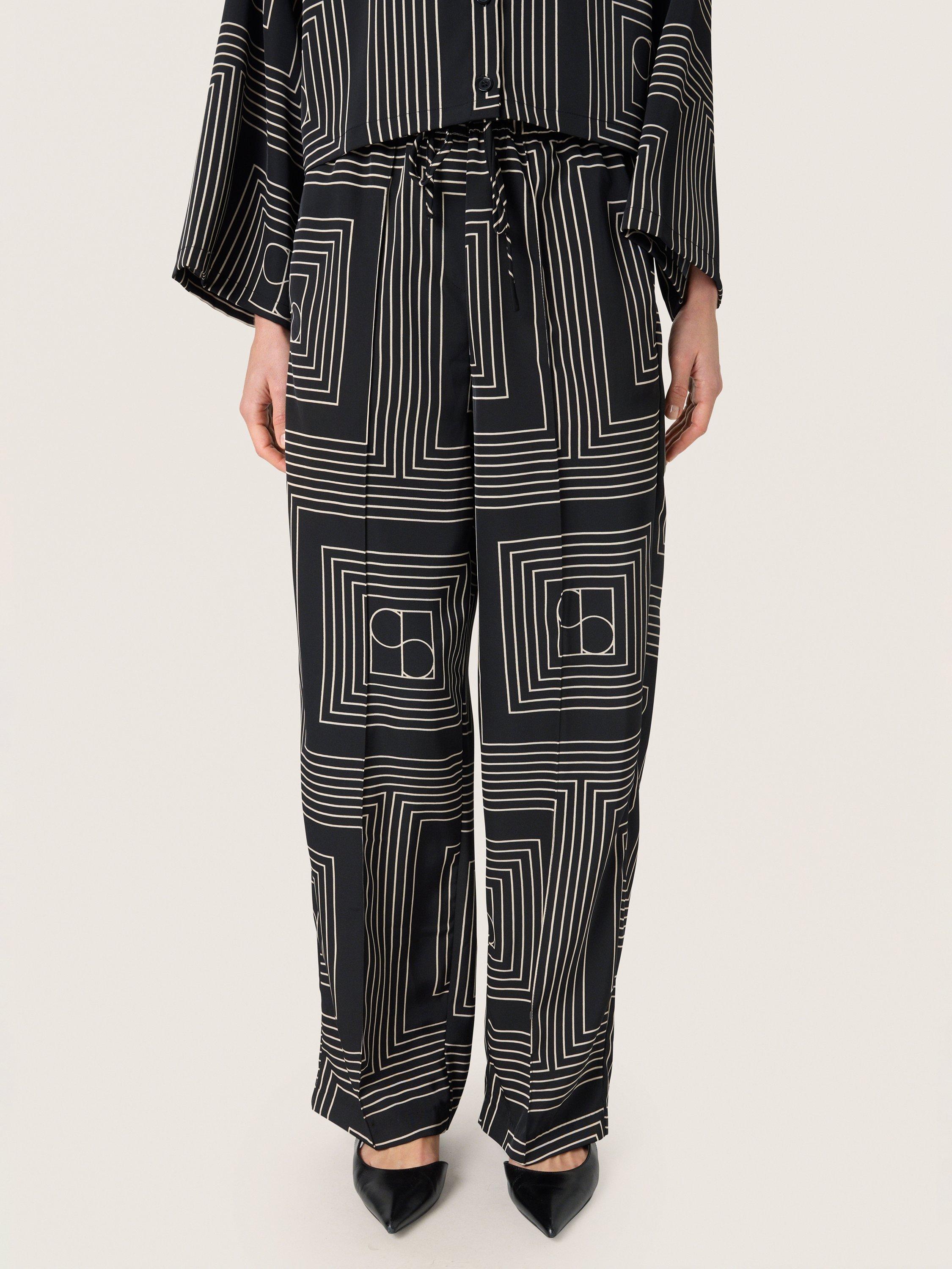 Product image 1 of 6, which shows Soaked In Luxury Topaz Faustina Trousers, Black/Multi, XS