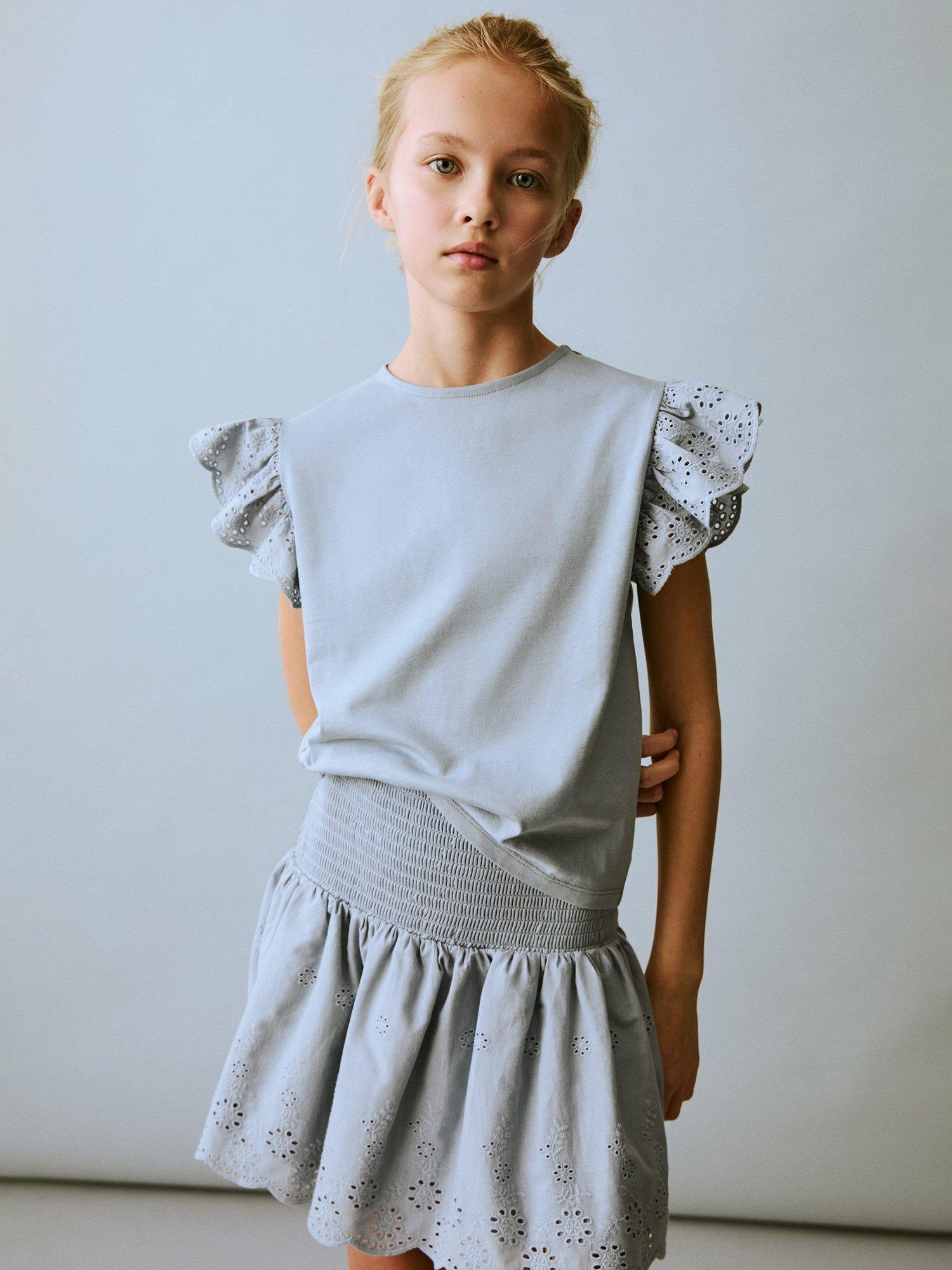 Product image 1 of 6, which shows Mango Kids' Cotta Embroidered Cotton Ruffle Mini Skirt, Pastel Blue, 11-12 yrs