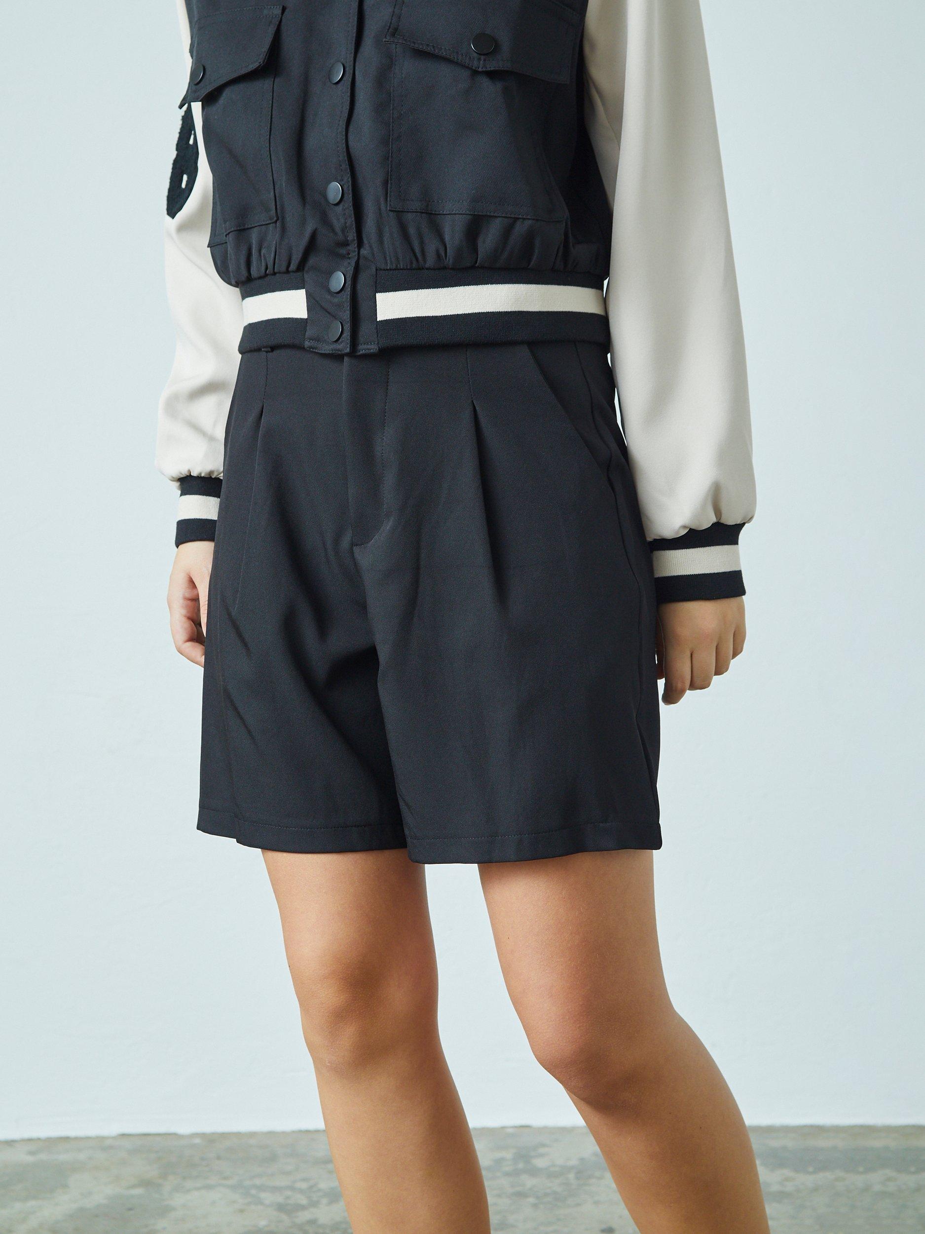 Product image 1 of 4, which shows Sisters Point GREAT-SHO High Waisted Front Pleated Shorts, Black, XS