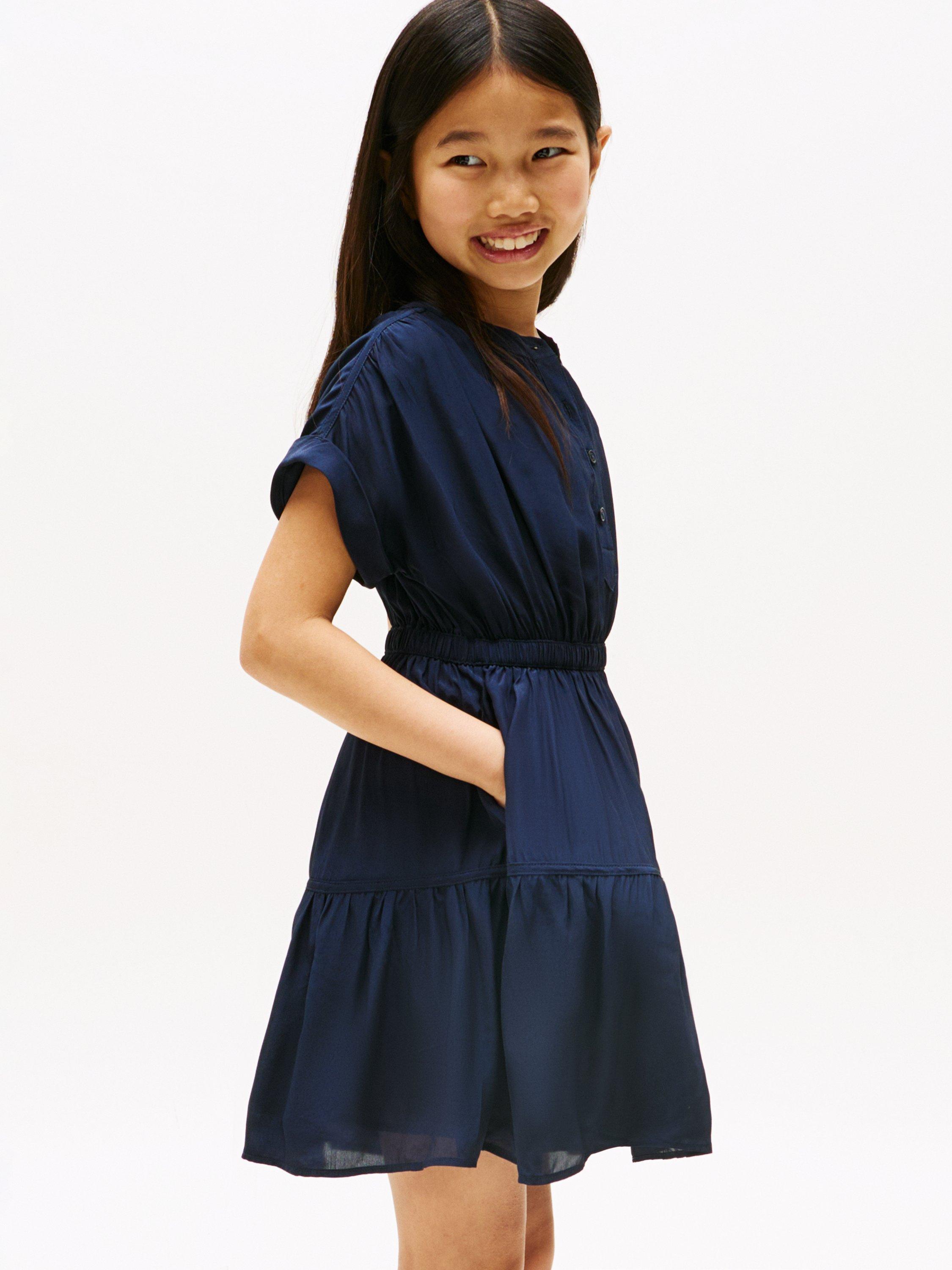 Product image 3 of 5, which shows Tommy Hilfiger Kids' Short Sleeved Tiered Button Dress, Dark Night Navy, 3 years