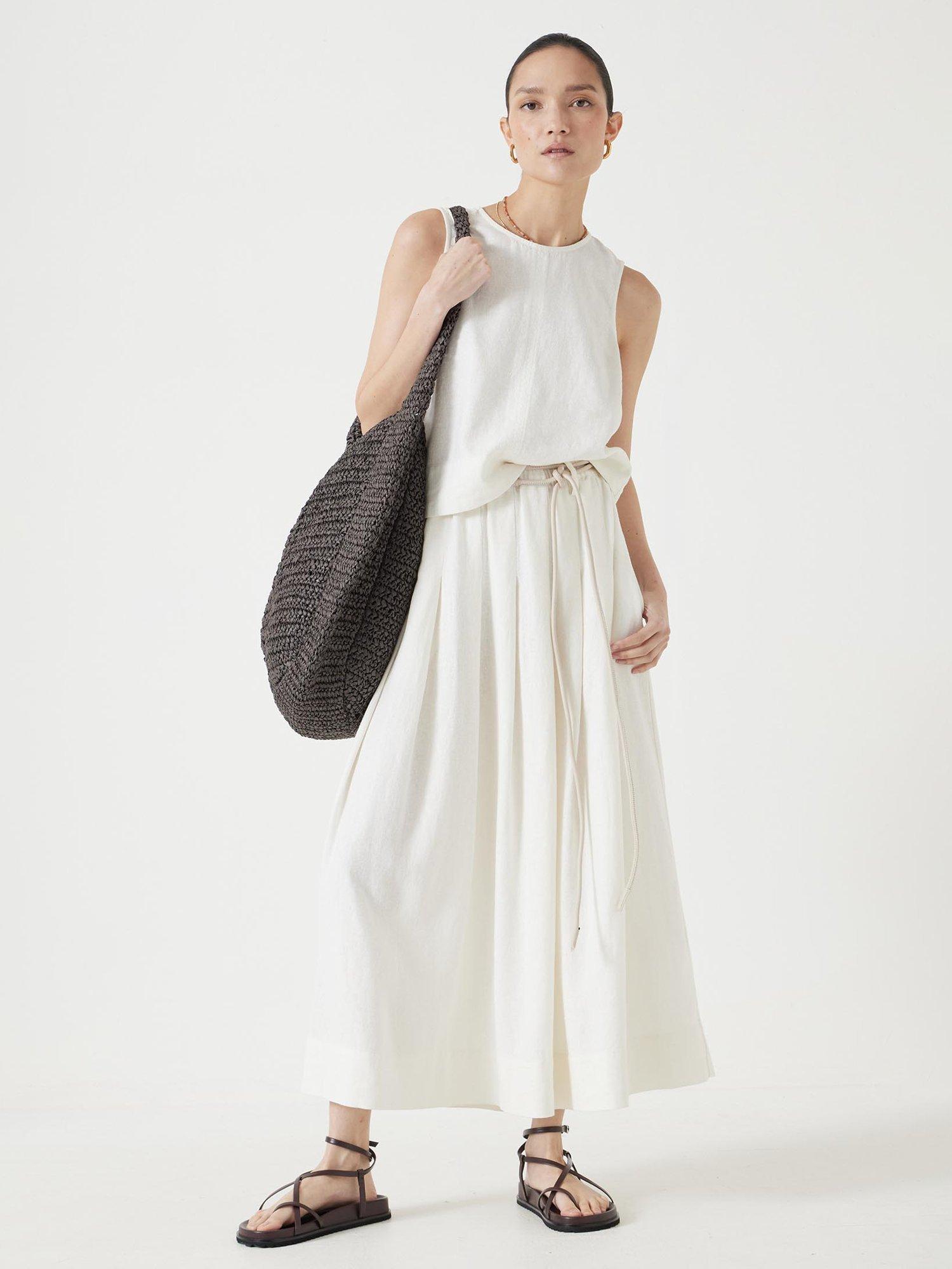 Product image 1 of 5, which shows HUSH Ivy Linen Blend Pleated Midi Skirt, White, 12