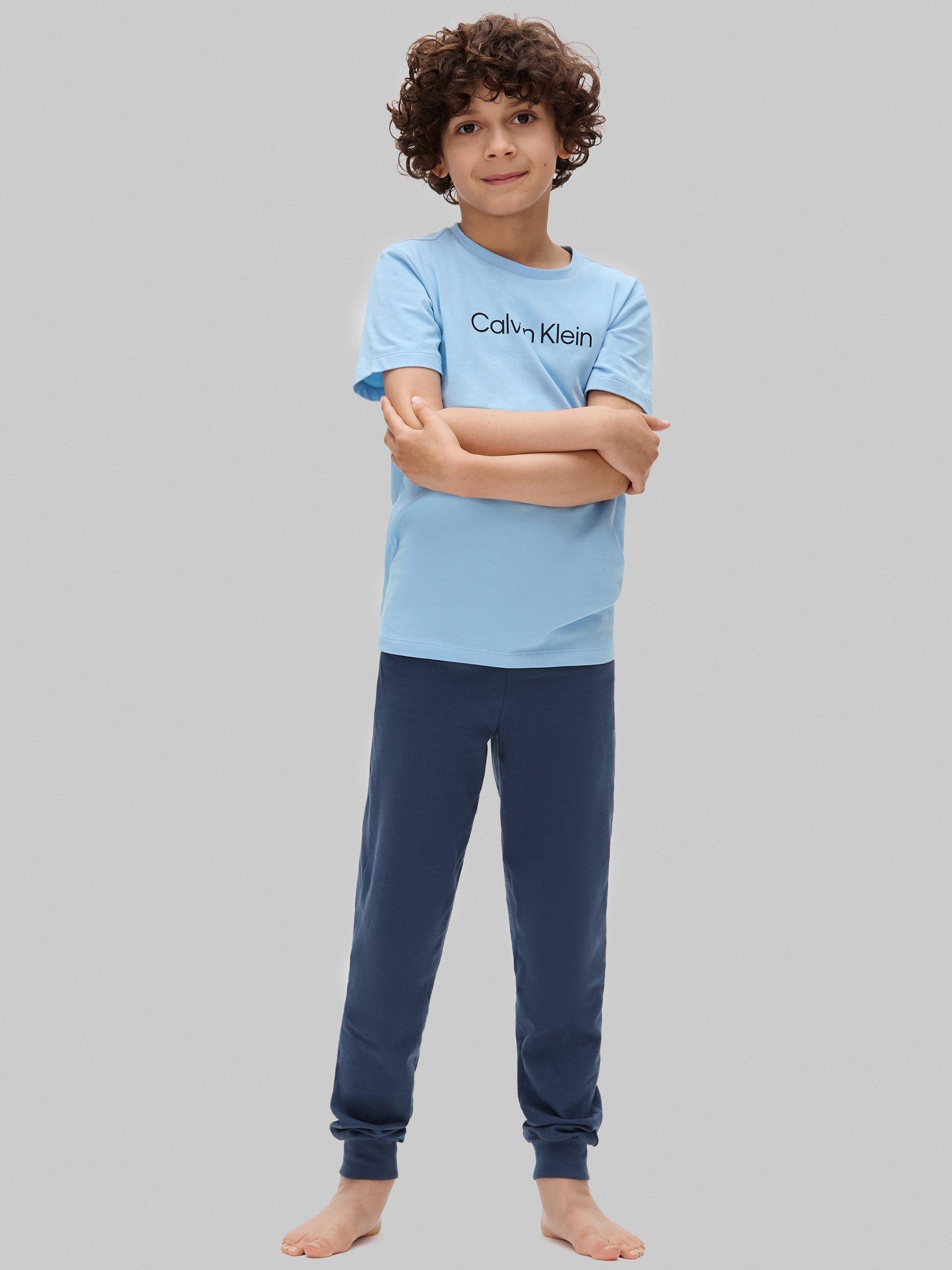 Product image 1 of 6, which shows Calvin Klein Kids' Cotton T-Shirt and Joggers Pyjama Set, Oceana/W/Bluebell, 8-10 years