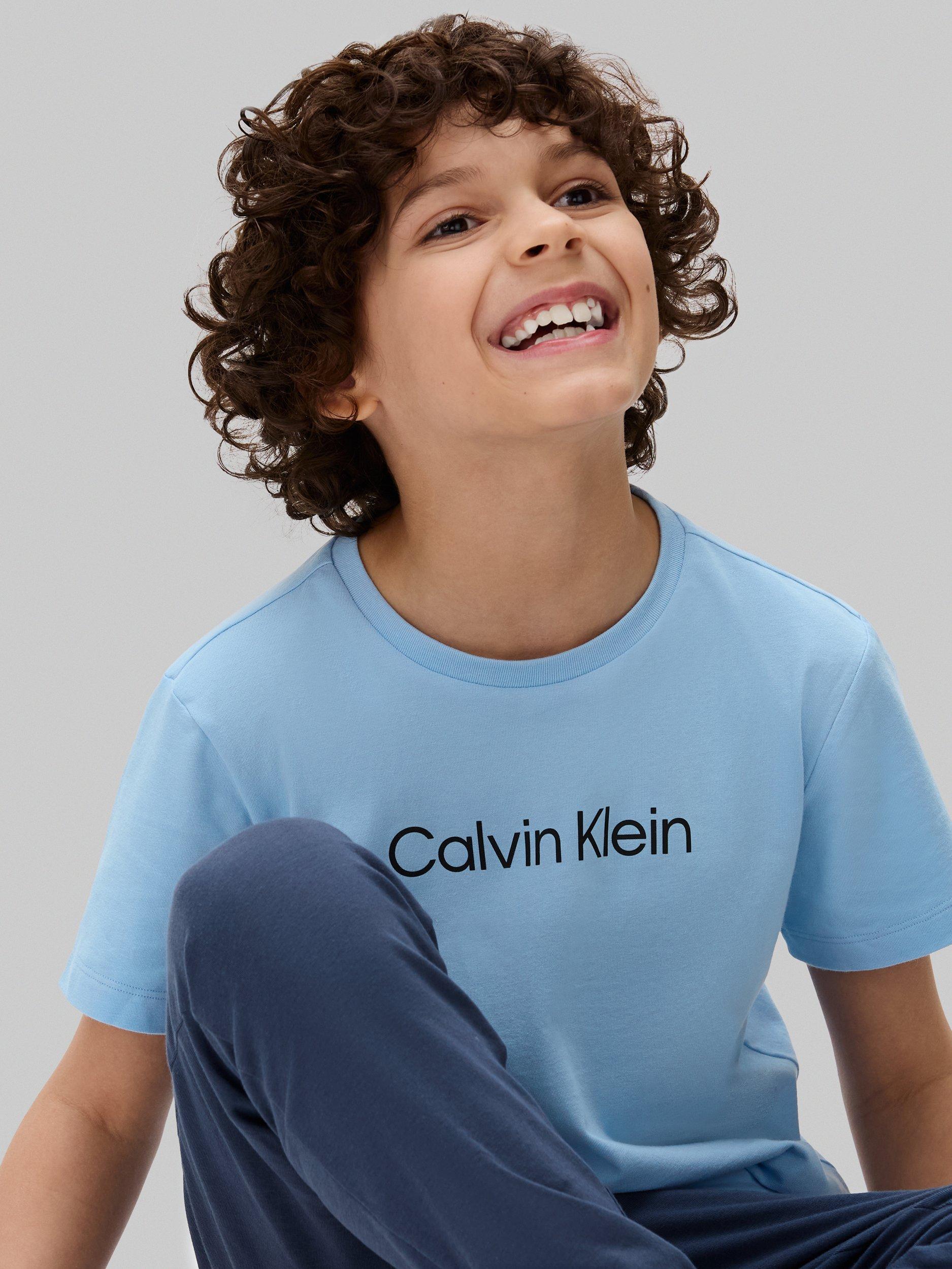 Product image 6 of 6, which shows Calvin Klein Kids' Cotton T-Shirt and Joggers Pyjama Set, Oceana/W/Bluebell, 8-10 years