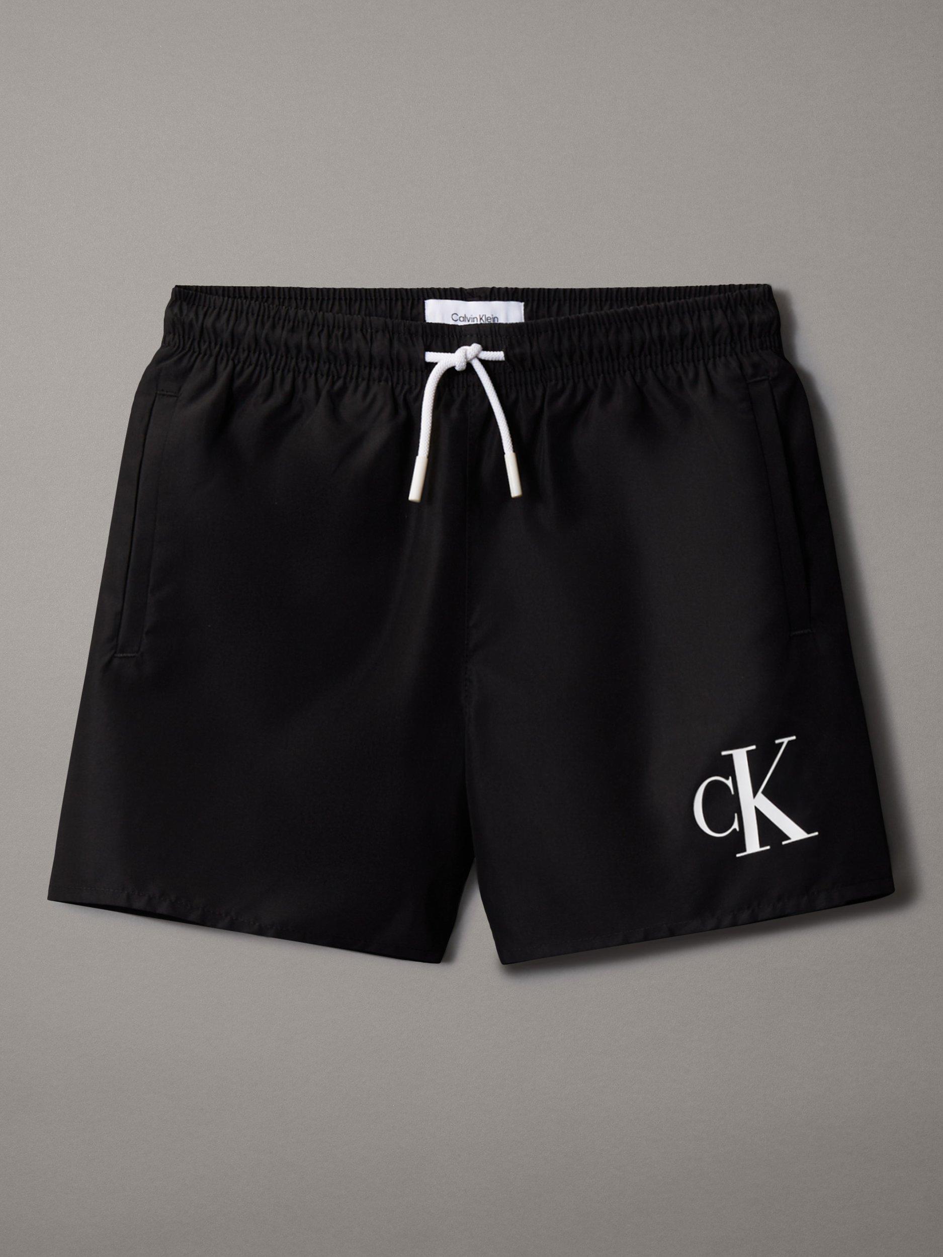 Product image 1 of 2, which shows Calvin Klein Kids' Intense Power Swim Shorts, Pvh Black, 8 yrs