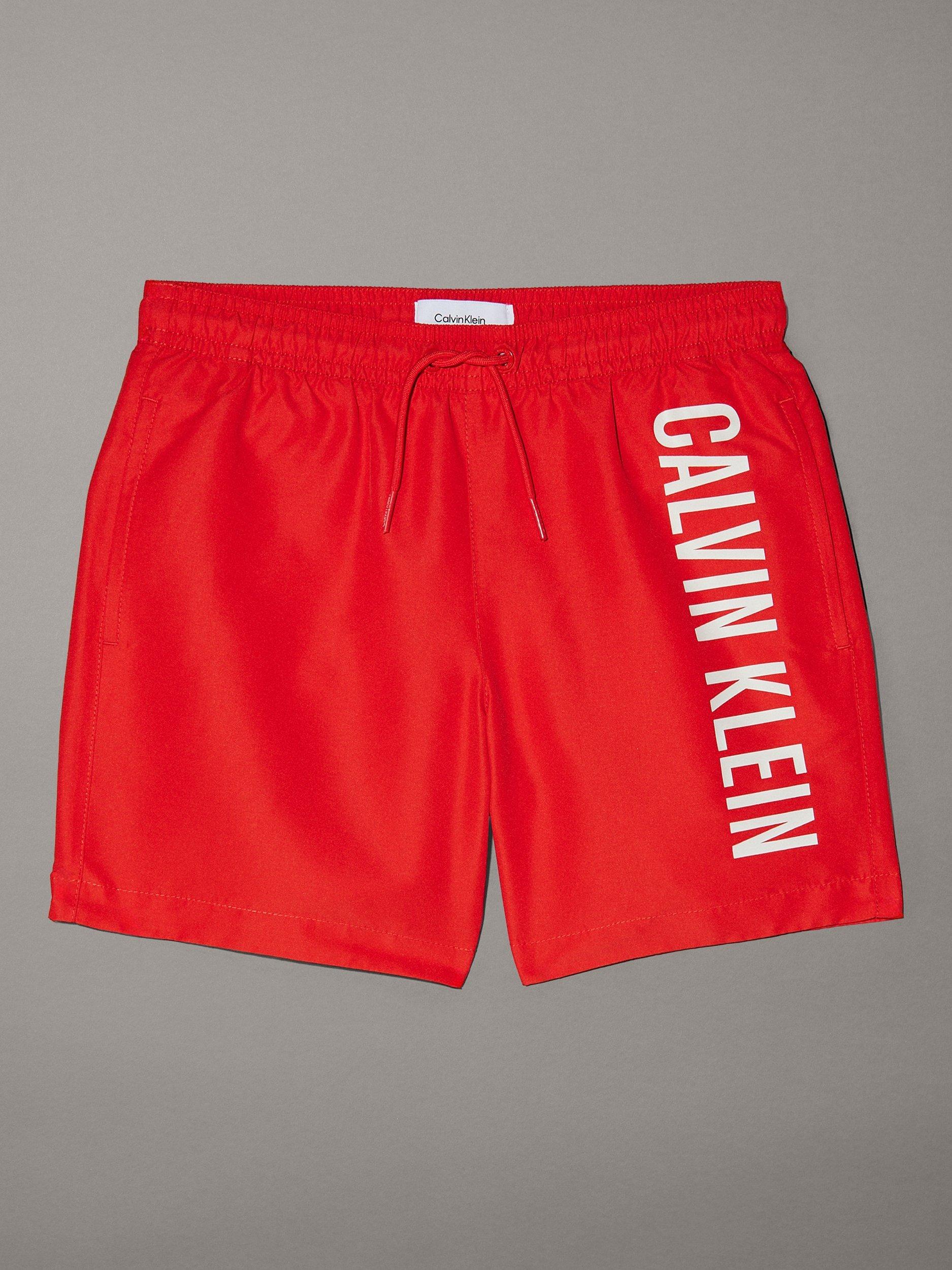 Product image 1 of 2, which shows Calvin Klein Kids' Intense Power Swim Shorts, Flaming Chili, 8 years