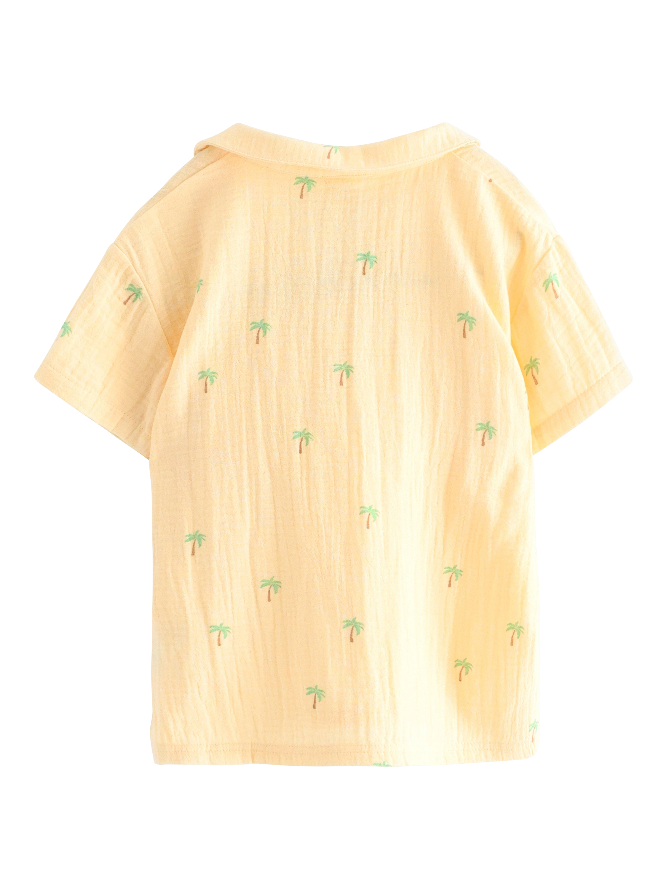 Product image 2 of 3, which shows Lindex Kids' Cotton Palm Tree Print Polo Shirt, Light Dusty Yellow, 18-24 months
