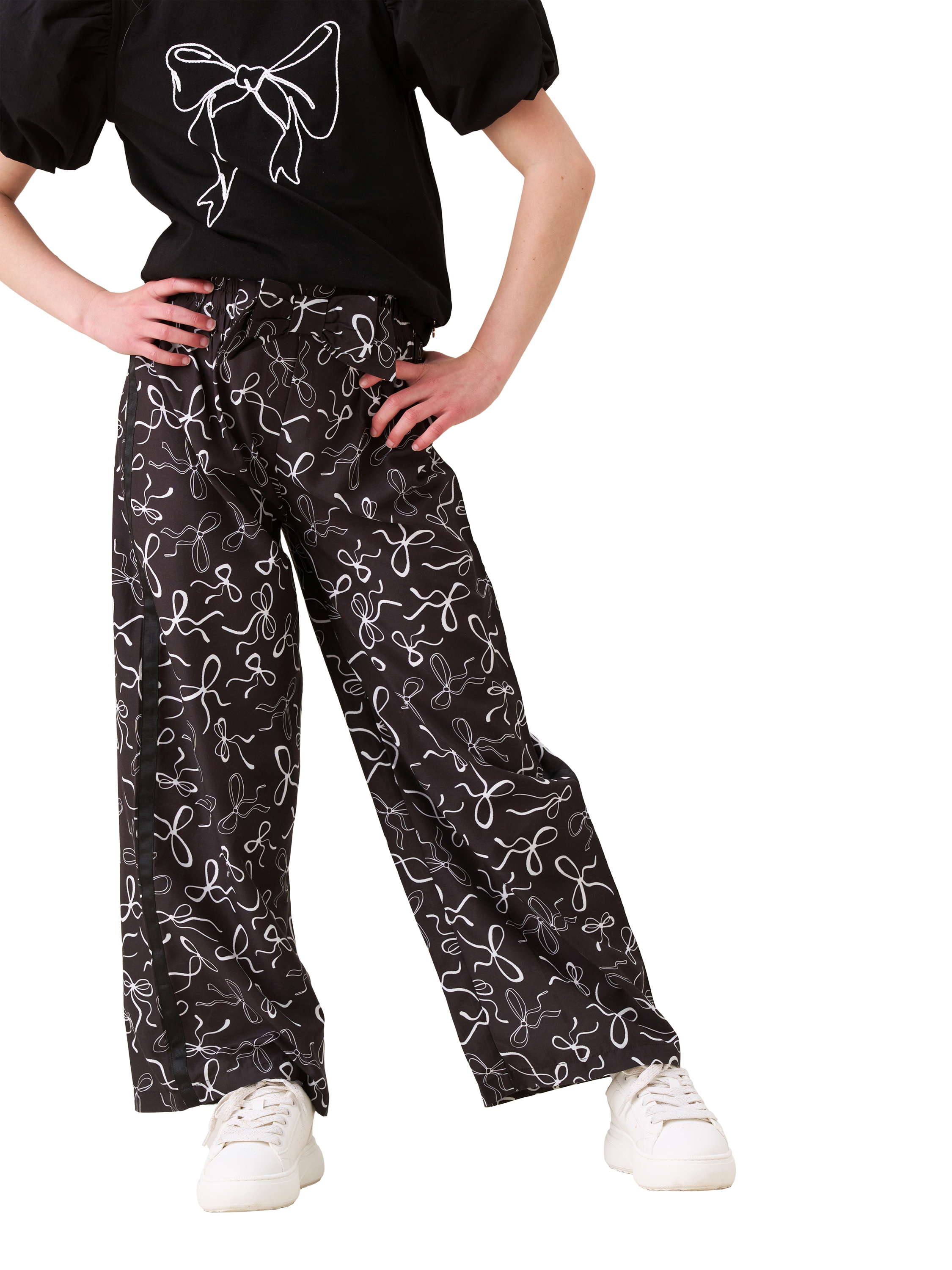 Product image 2 of 7, which shows Angel & Rocket Kids' Bow Print Wide Leg Trousers, Black, 3 years