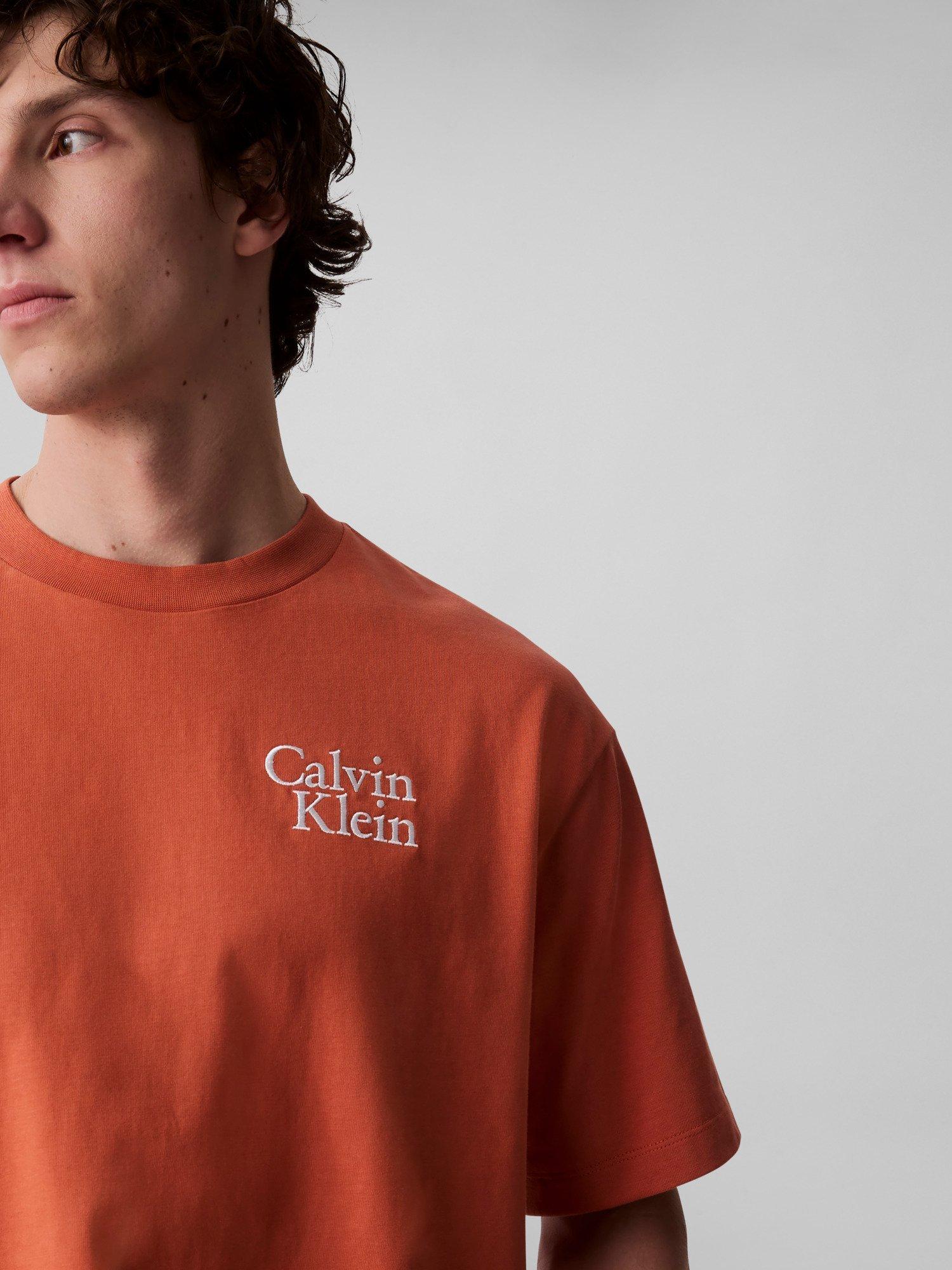 Product image 4 of 5, which shows Calvin Klein Cotton Regular Fit Short Sleeve Logo T-Shirt, Mecca Orange, L