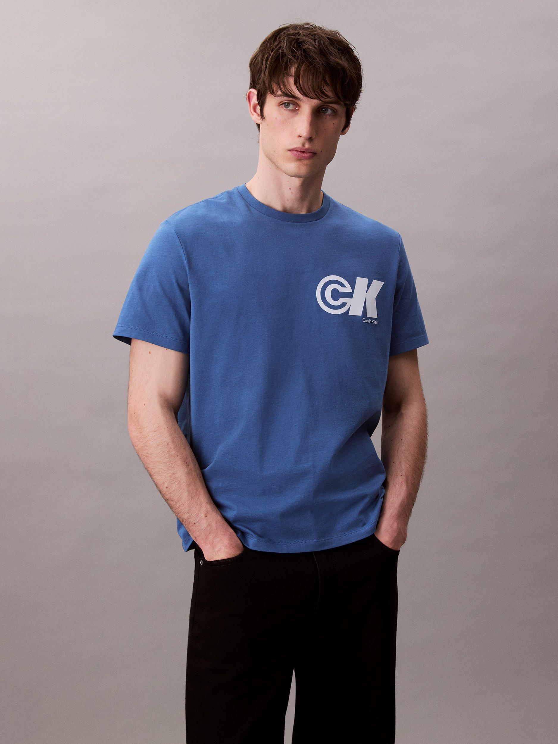 Product image 1 of 4, which shows Calvin Klein Cotton Regular Fit Short Sleeve CK Logo T-Shirt, Royal Lagoon, L