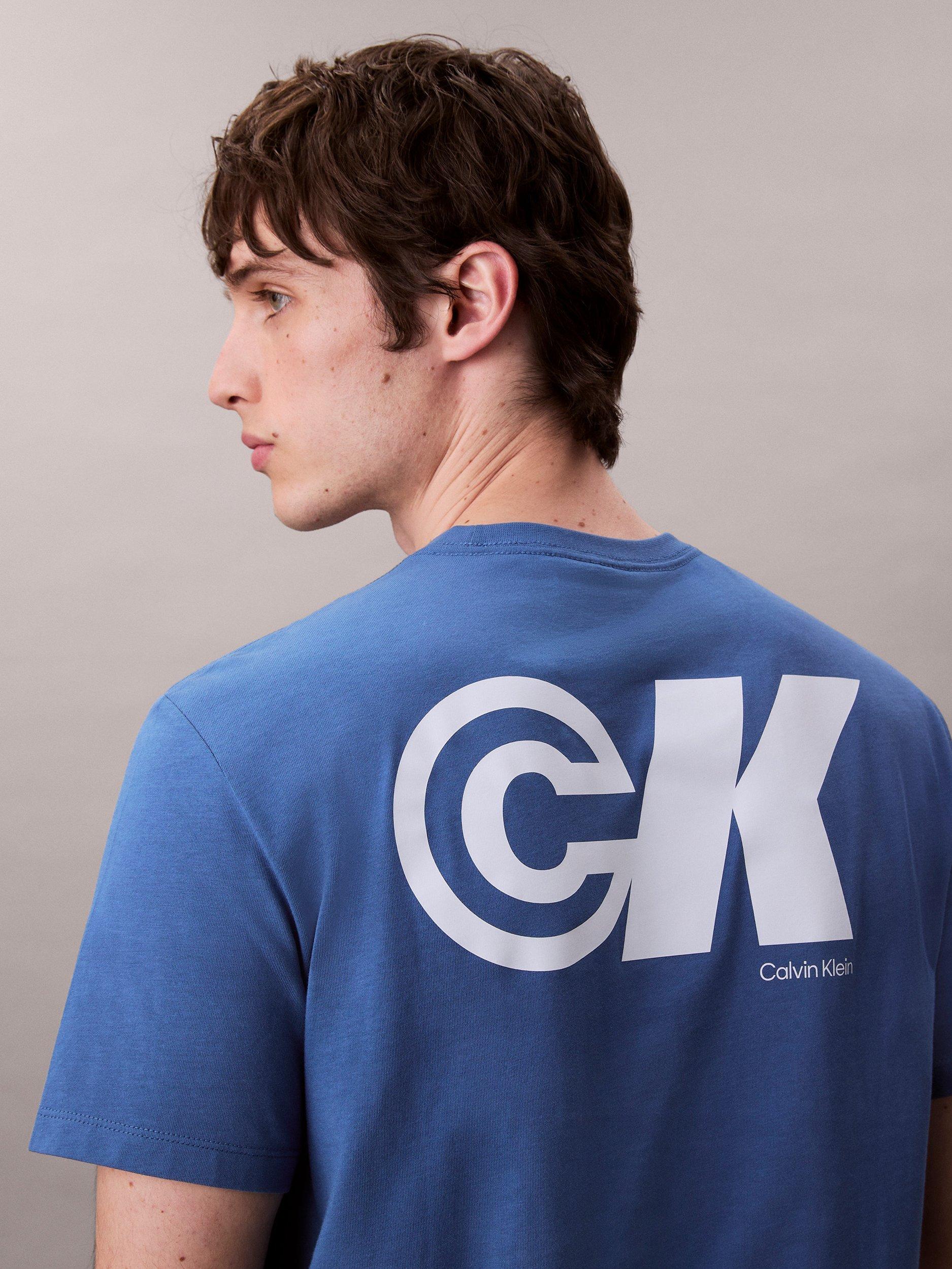 Product image 2 of 4, which shows Calvin Klein Cotton Regular Fit Short Sleeve CK Logo T-Shirt, Royal Lagoon, L