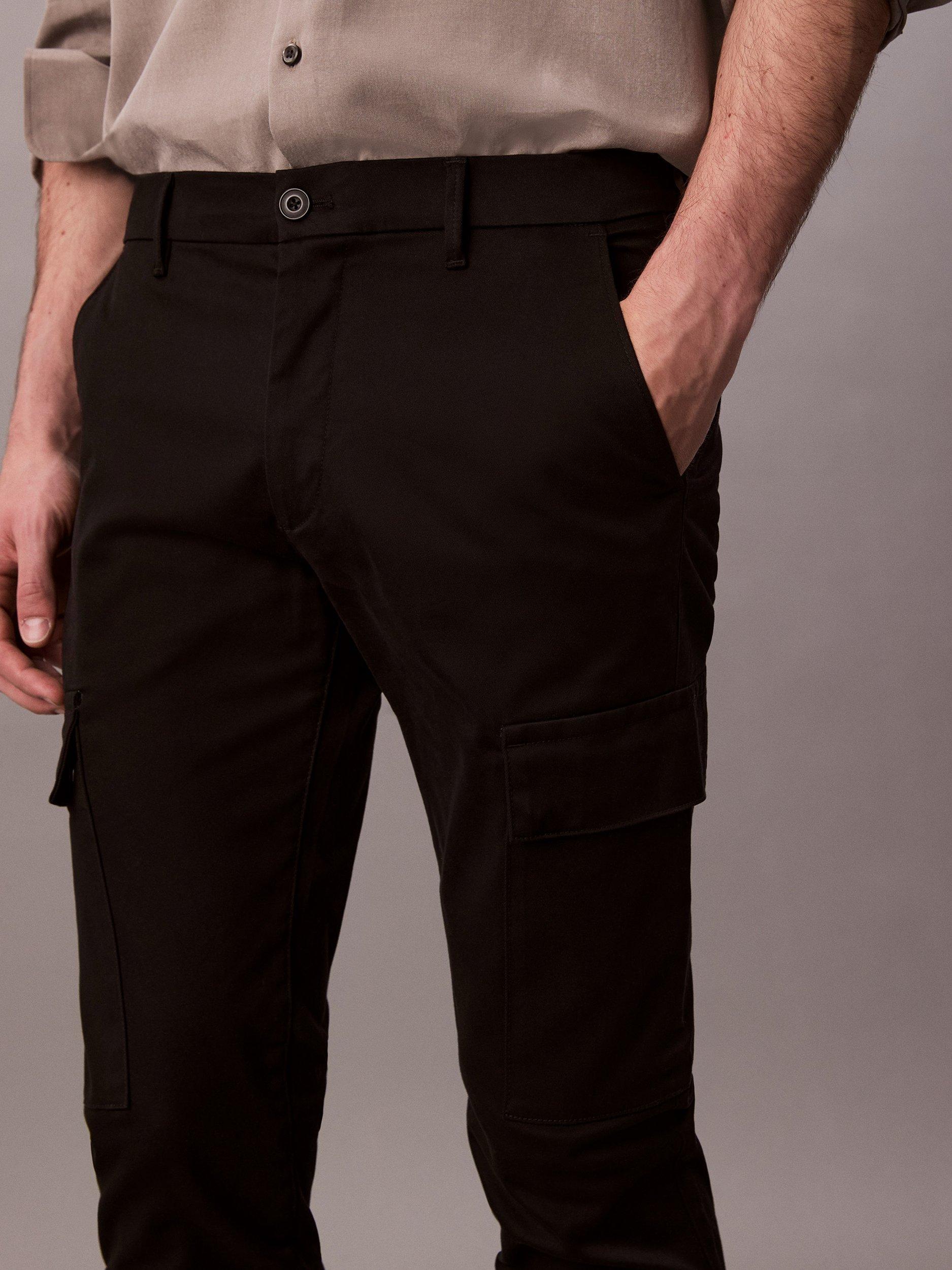 Product image 4 of 5, which shows Calvin Klein Cotton Blend Slim Stretch Cargo Trousers, Black, 33R