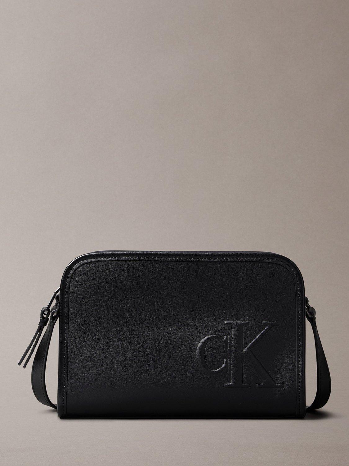 Product image 1 of 4, which shows Calvin Klein Faux Leather Crossbody Camera Bag, Black, One Size