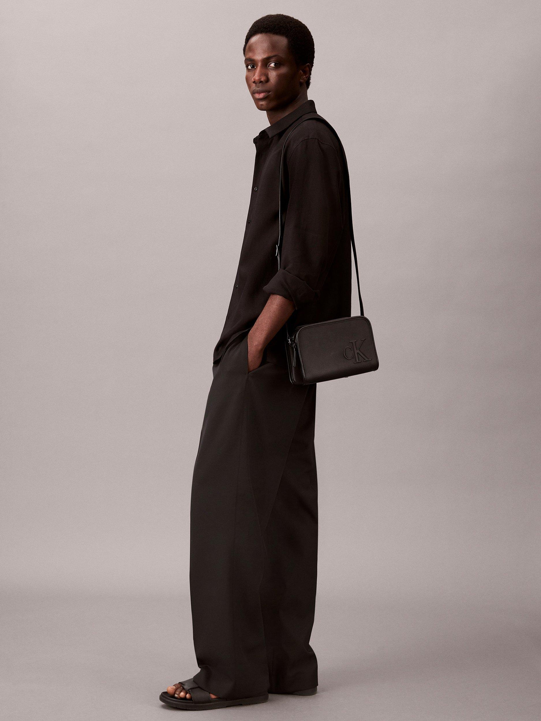 Product image 2 of 4, which shows Calvin Klein Faux Leather Crossbody Camera Bag, Black, One Size