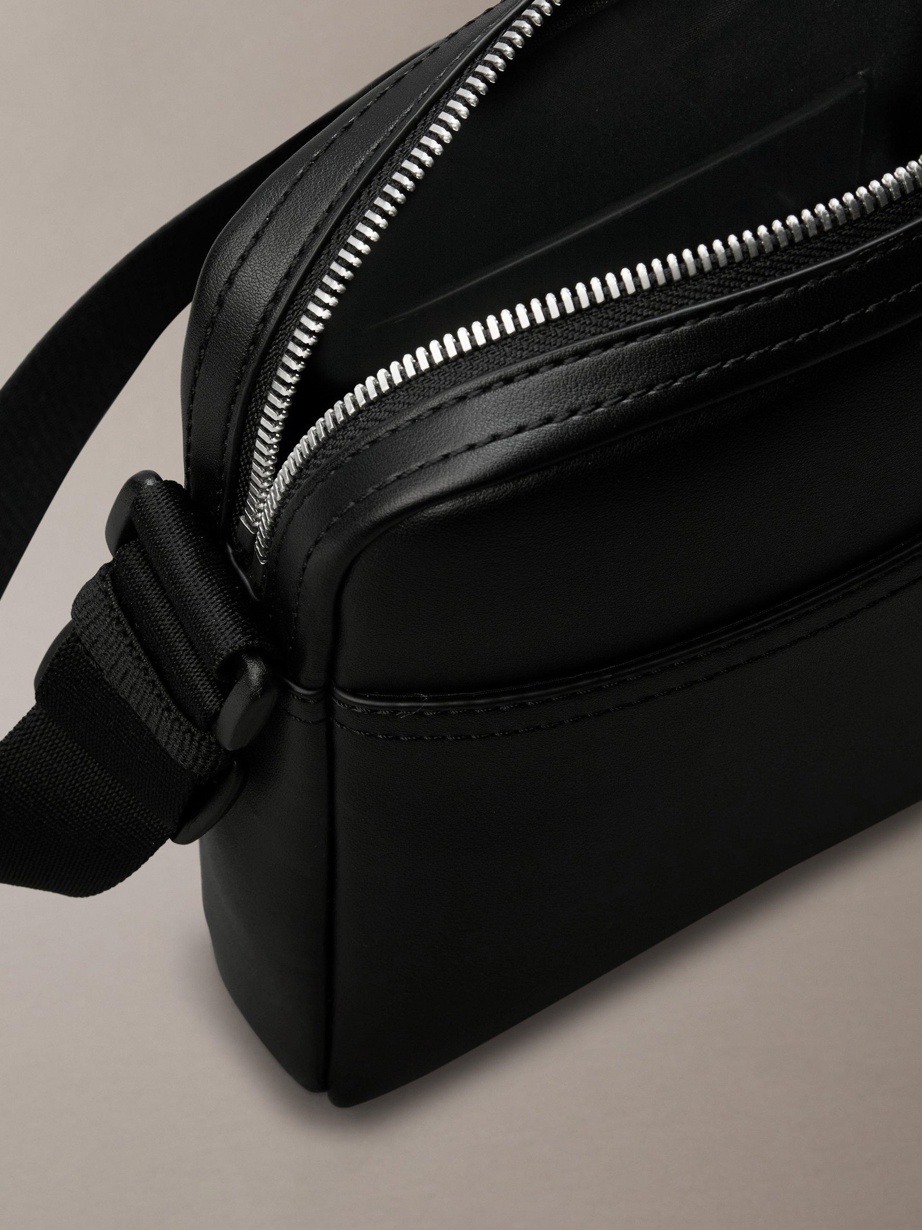 Product image 4 of 5, which shows Calvin Klein Faux Leather Reporter Bag, Black, One Size