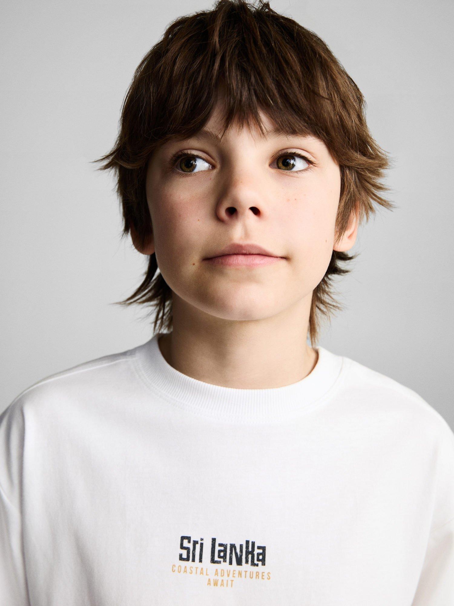 Product image 6 of 7, which shows Mango Kids' Cotton Sri Lanka T-Shirt, Natural White, 11-12 years