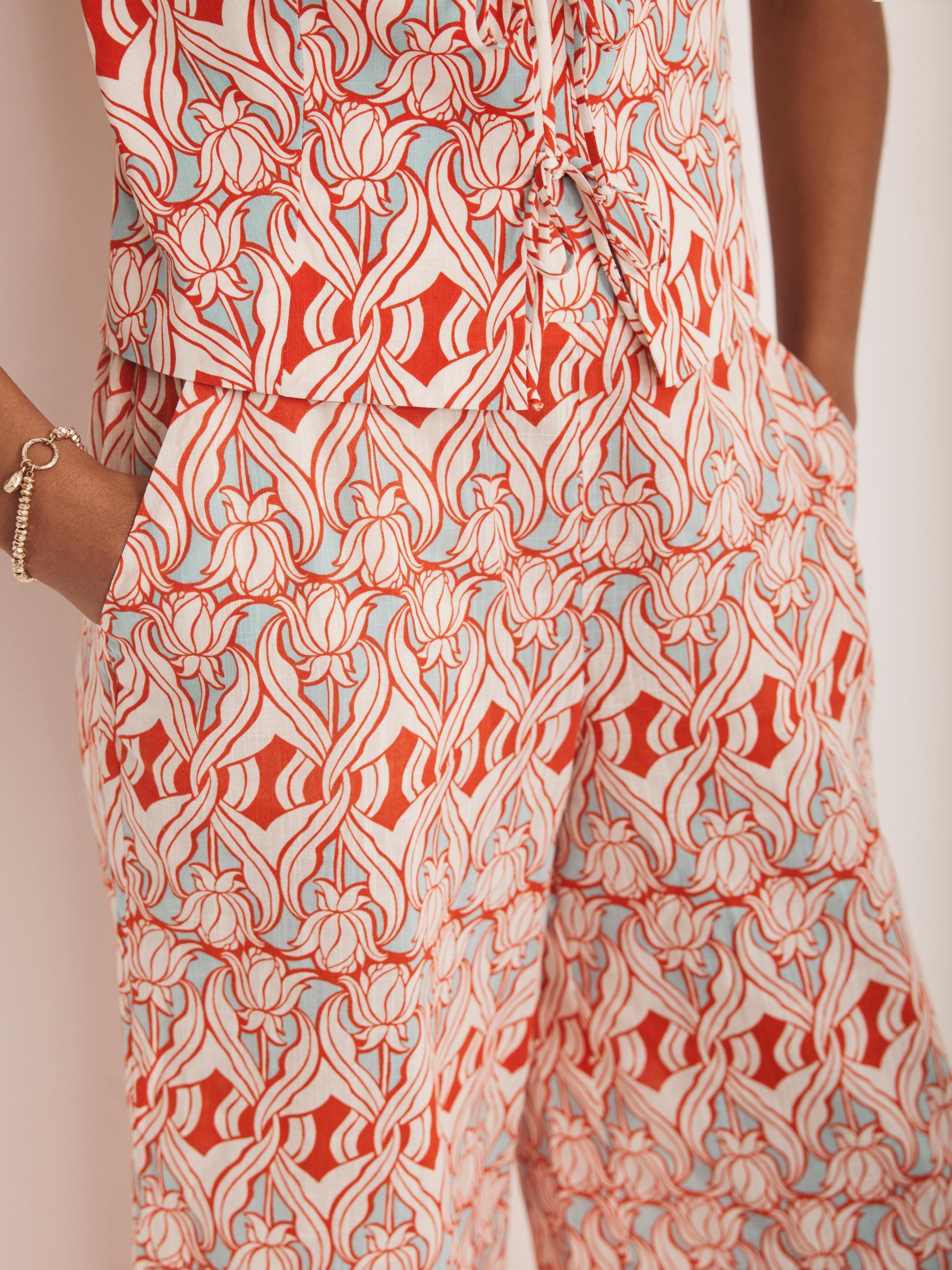Product image 4 of 7, which shows Mint Velvet Geometric Floral Wide Leg Trousers, Orange/Multi, XS