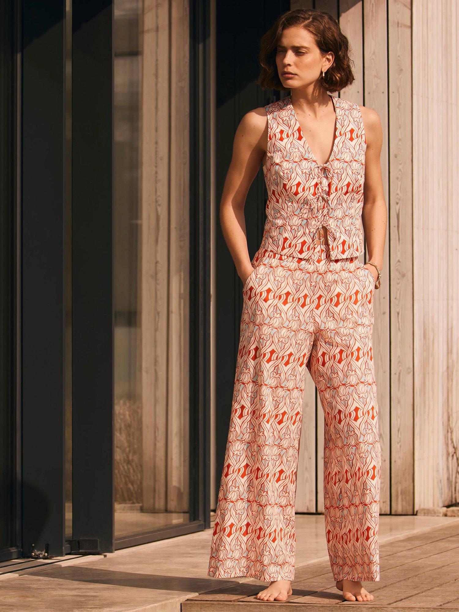 Product image 5 of 7, which shows Mint Velvet Geometric Floral Wide Leg Trousers, Orange/Multi, XS