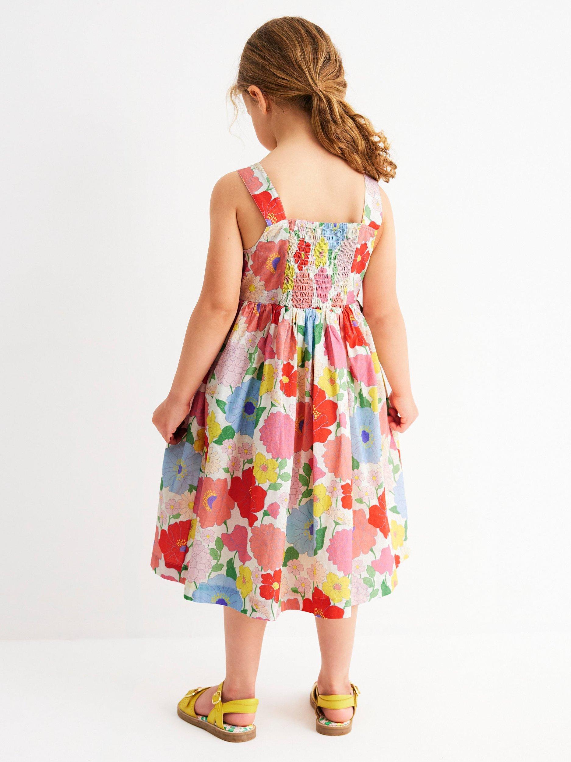 Product image 3 of 7, which shows Mini Boden Kids' Remy Cotton Sleeveless Button Dress, Multi Summer Garden, 8-9 years