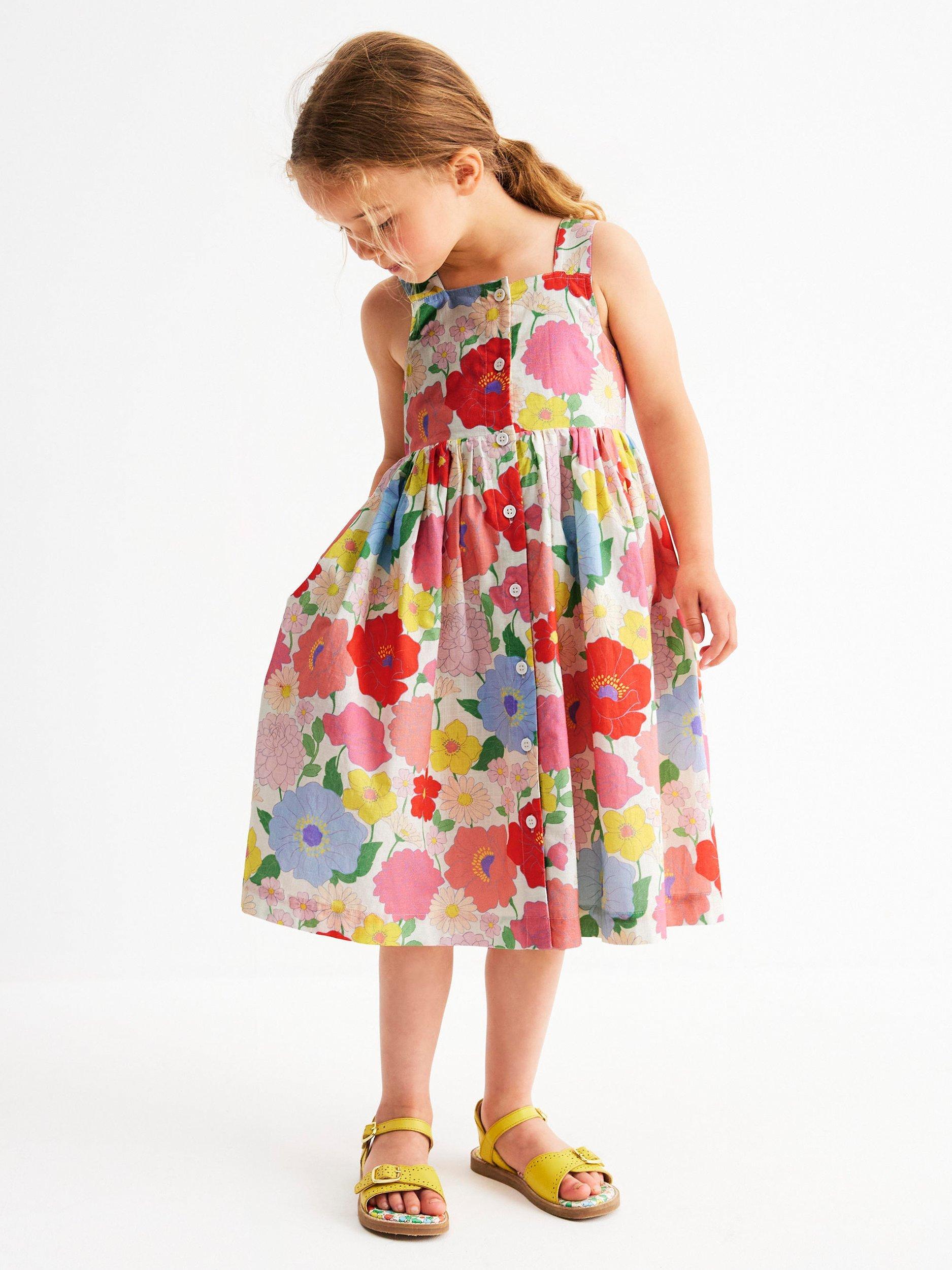 Product image 4 of 7, which shows Mini Boden Kids' Remy Cotton Sleeveless Button Dress, Multi Summer Garden, 8-9 years