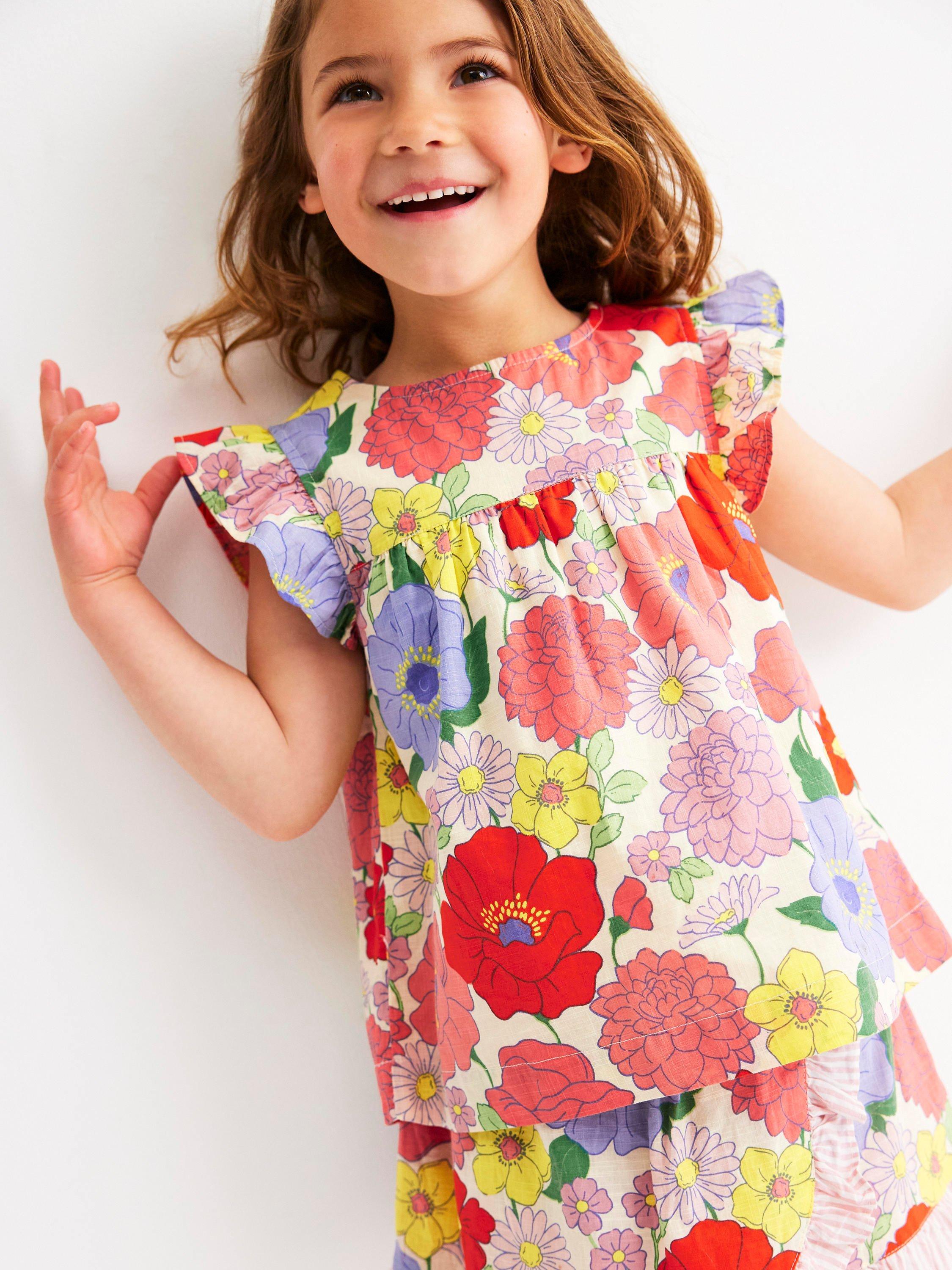 Product image 1 of 6, which shows Mini Boden Kids' Juniper Cotton Frill Sleeved Top, Multi Summer Garden, 3-4 years